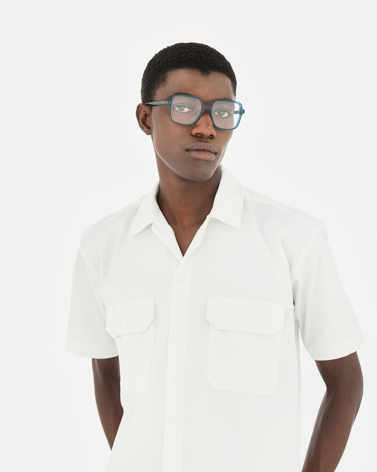 Front try-on view of RETROSUPERFUTURE Numero 149 Teal sunglasses on model.