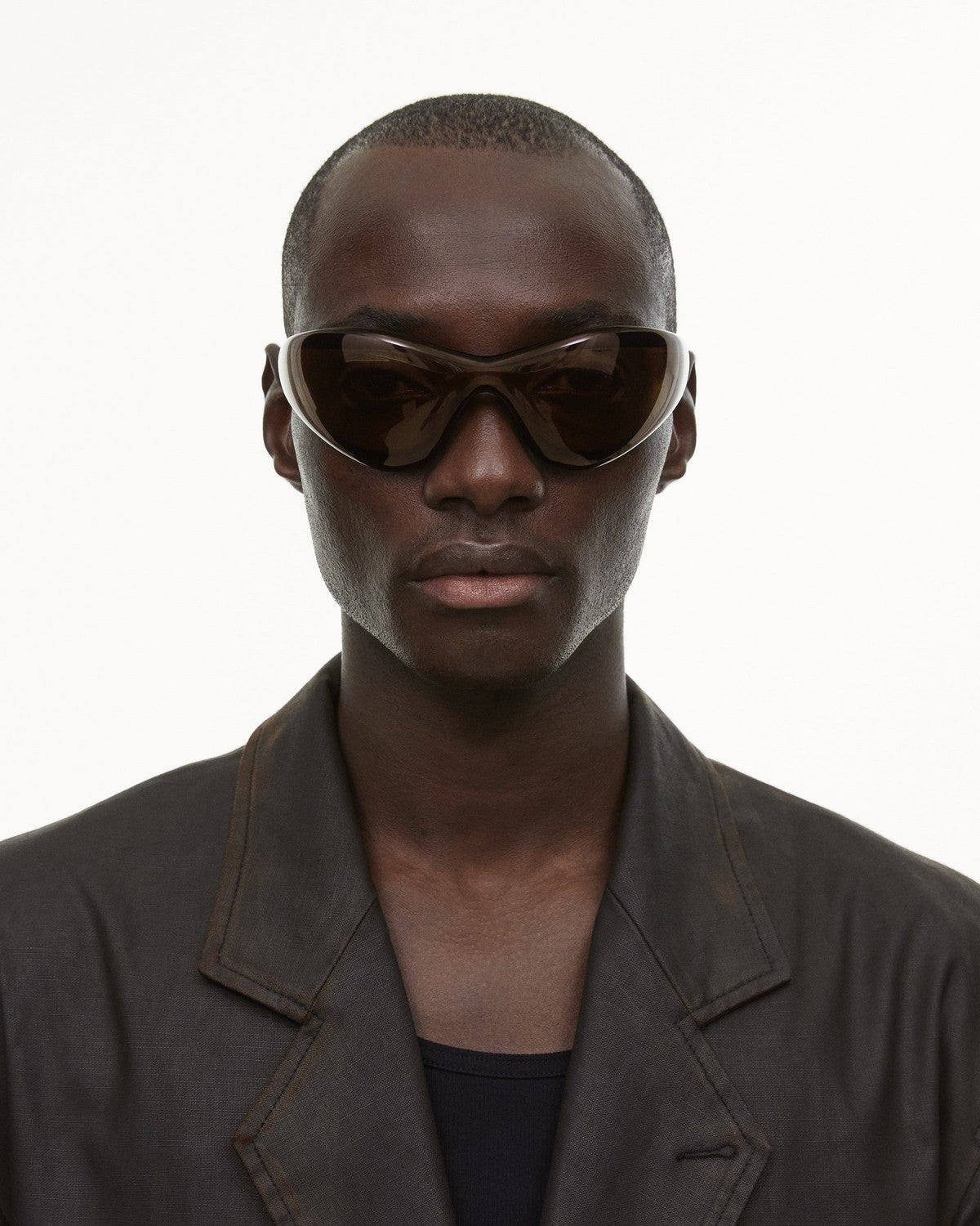 Model wearing CHIMI One Brown Brown sunglasses, front view.