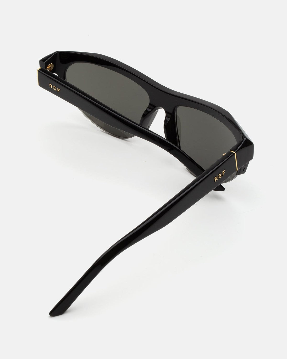 Interior view from above of RETROSUPERFUTURE Ora Black sunglasses showing temples and branding.