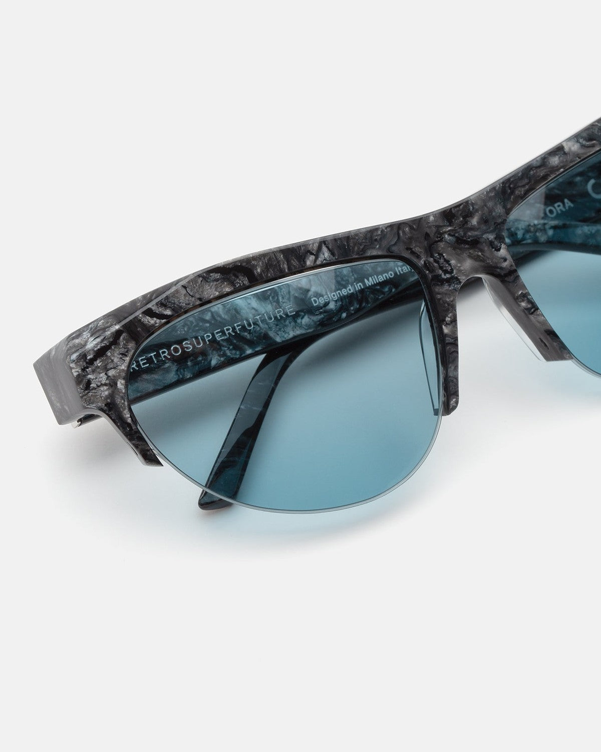 Close-up of the textured frame and lens detail on RETROSUPERFUTURE Ora Granito sunglasses.