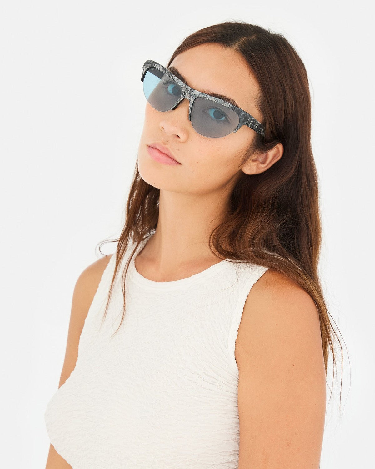 Model wearing RETROSUPERFUTURE Ora Granito sunglasses.