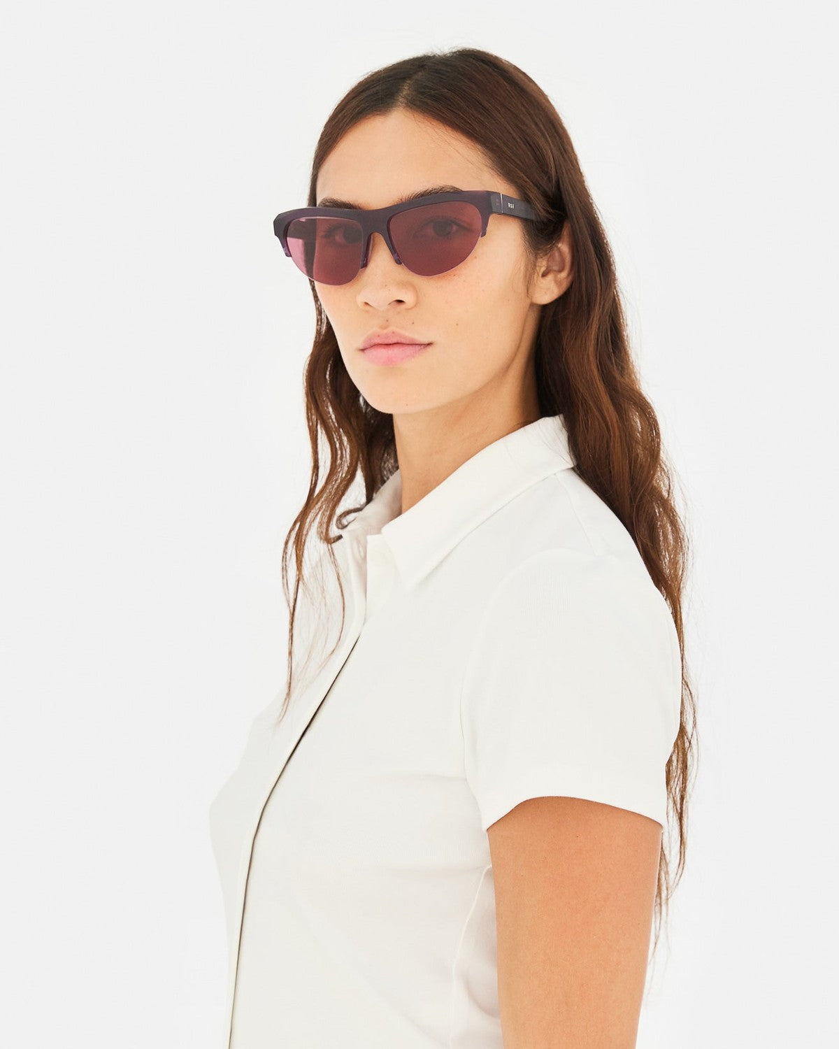 Model wearing RETROSUPERFUTURE Ora Melanzana sunglasses.
