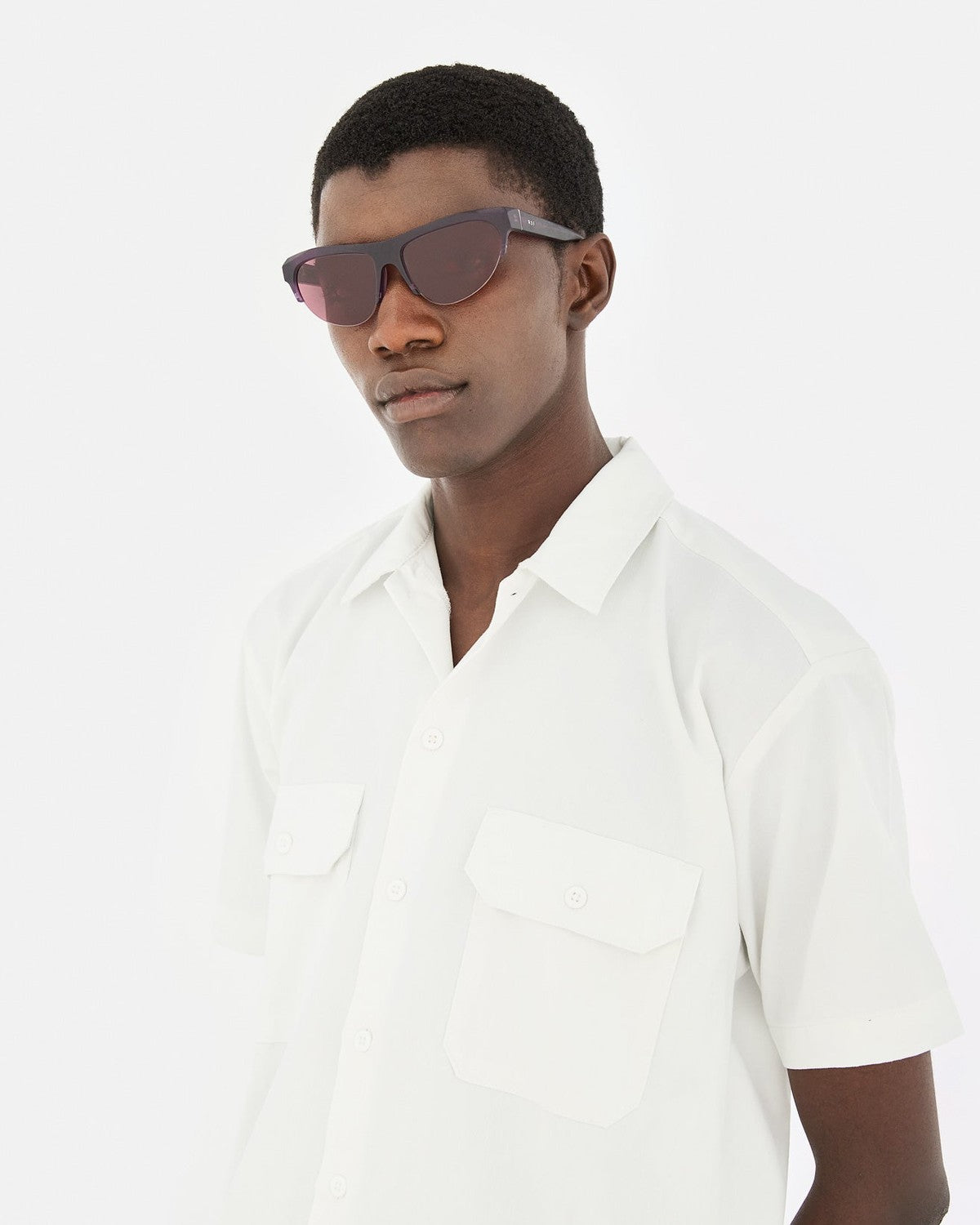 Model wearing RETROSUPERFUTURE Ora Melanzana sunglasses in side profile.