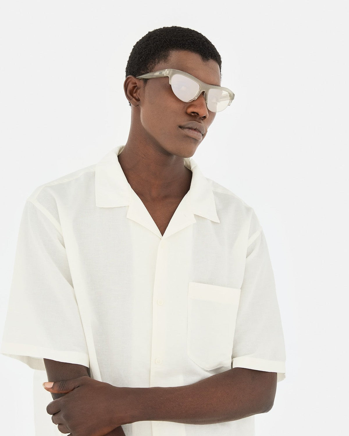 Model wearing RETROSUPERFUTURE Ora Nebbia sunglasses in side profile.