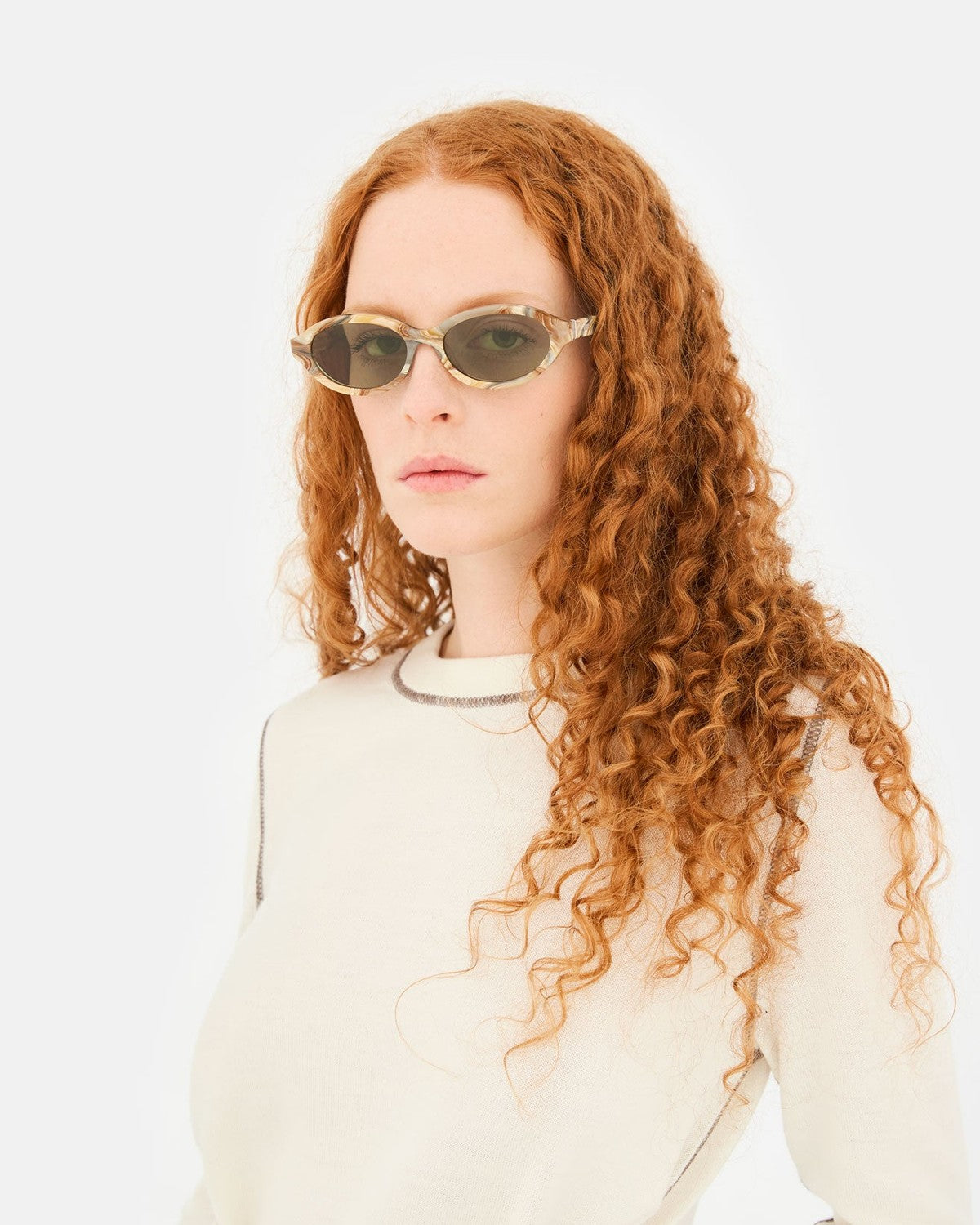 Model wearing RETROSUPERFUTURE Parola Boogie sunglasses indoors.