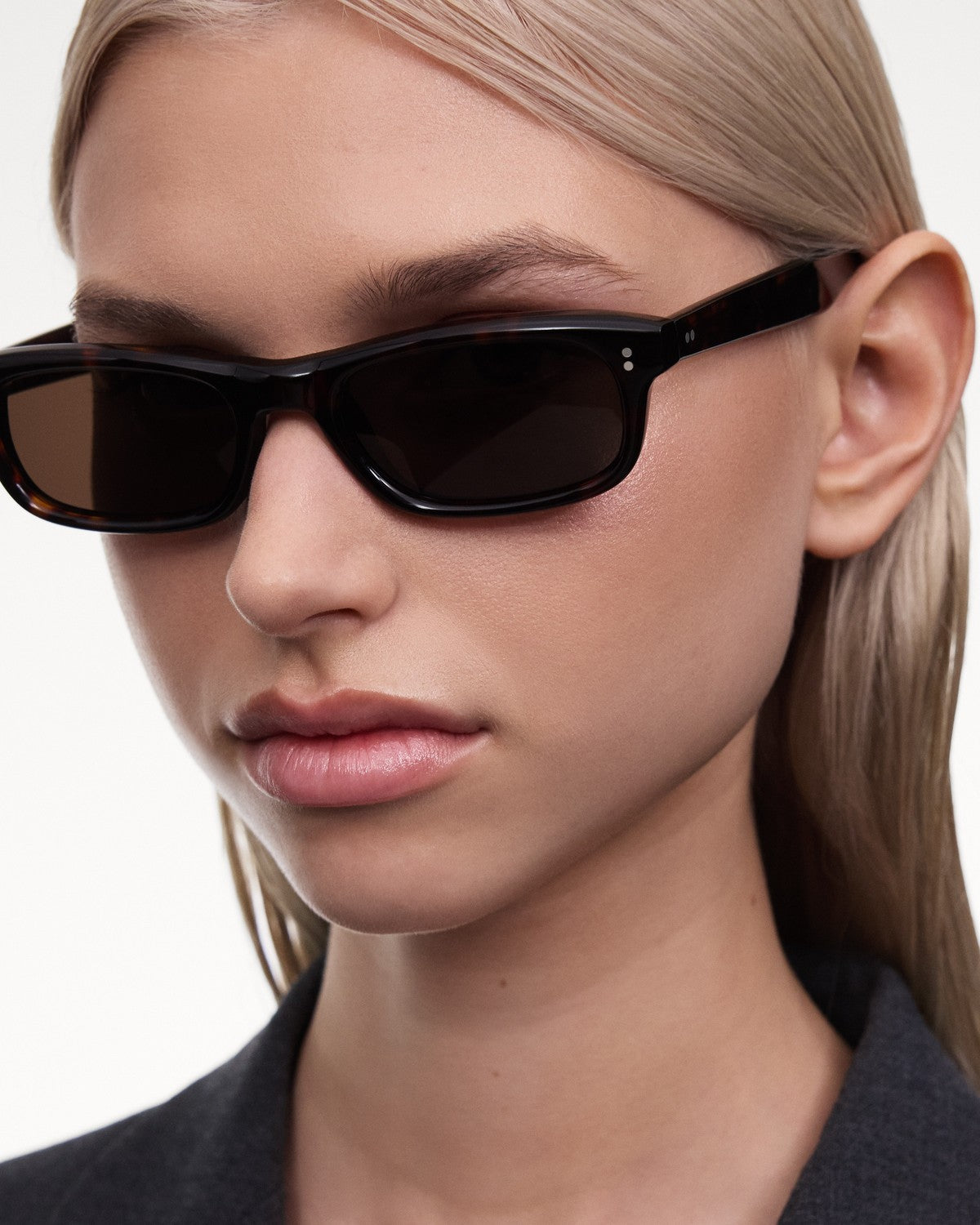 Model wearing CHIMI Pin Tortoise sunglasses, angled view showing right side.