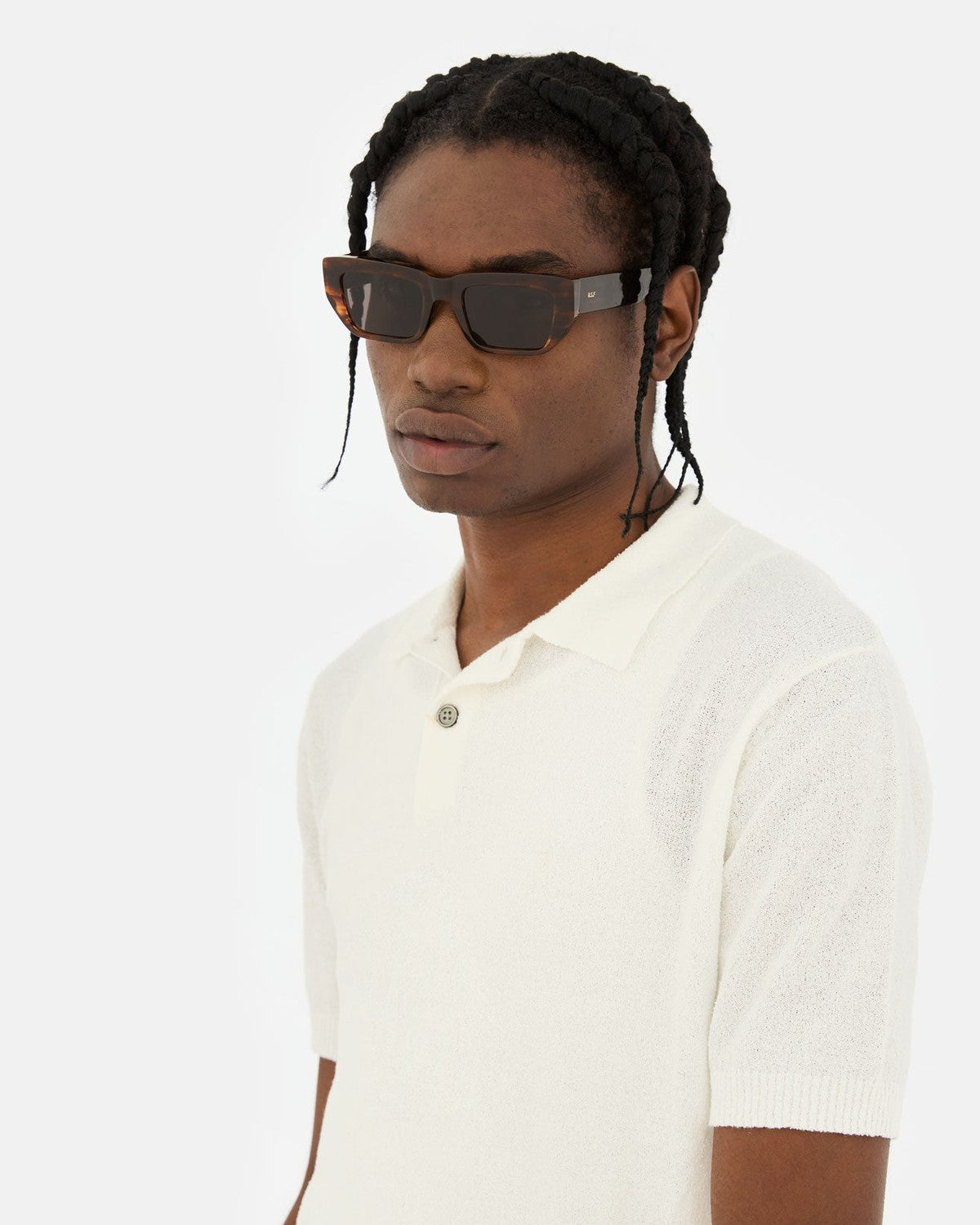 Side profile of model wearing RETROSUPERFUTURE Ra Havana Striata sunglasses.