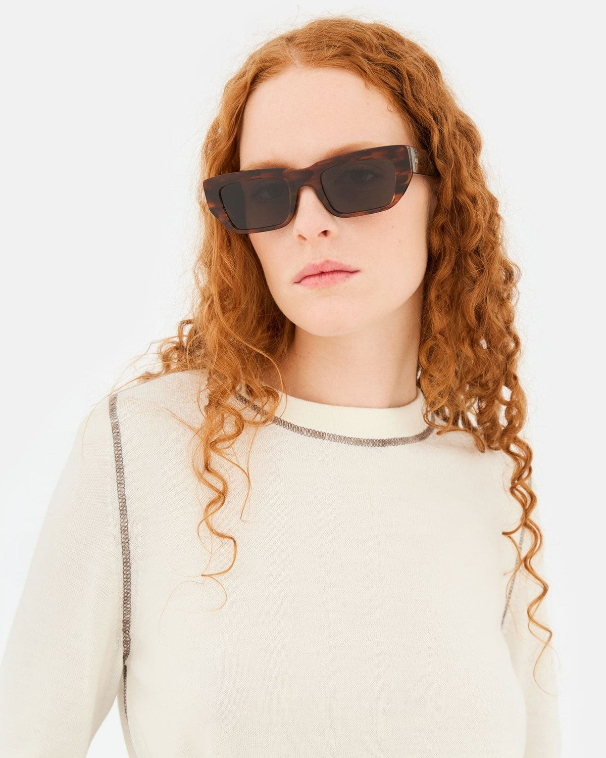Front view of model wearing RETROSUPERFUTURE Ra Havana Striata sunglasses.