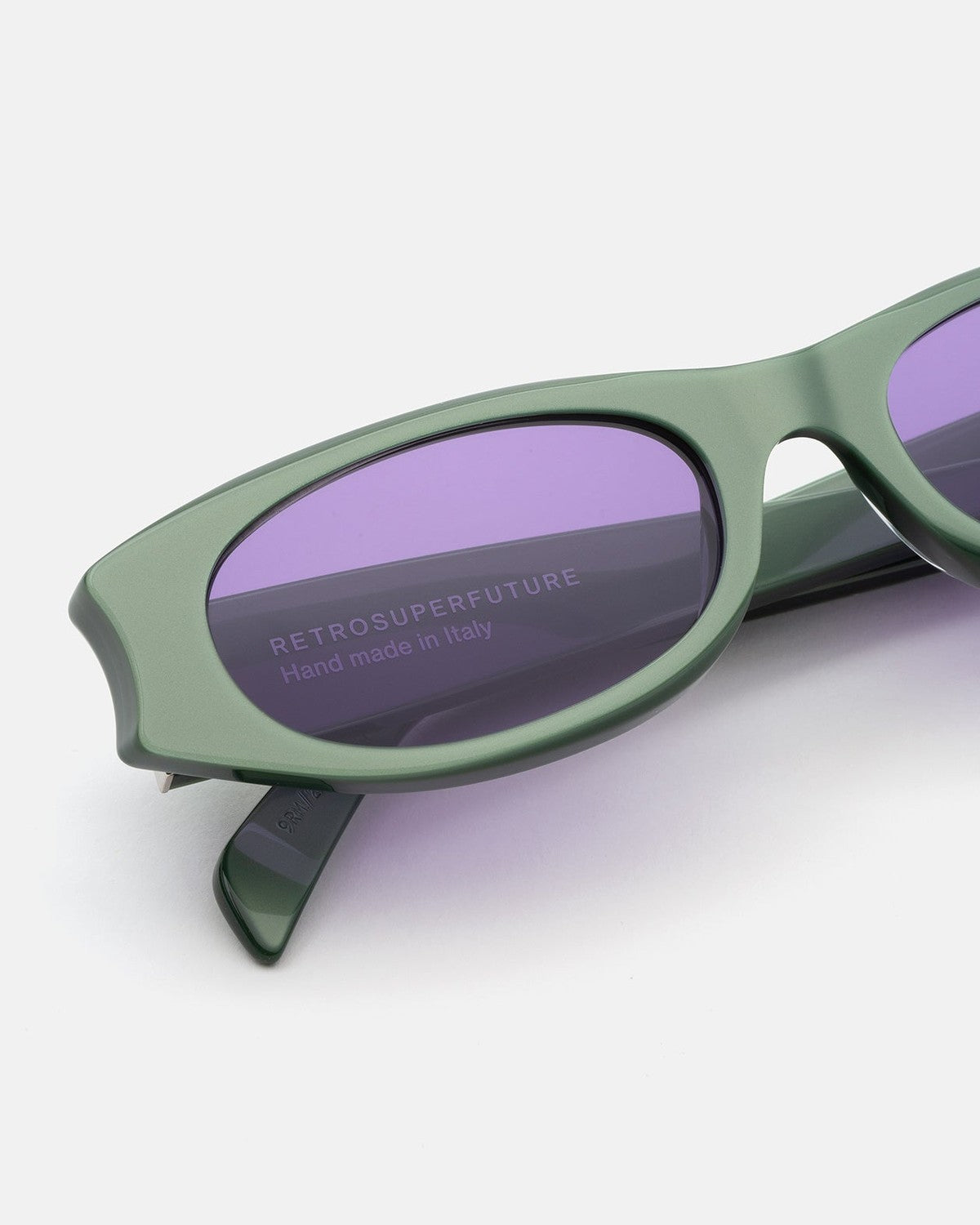 Close-up of the temple and lens branding on RETROSUPERFUTURE Razzo Metallic Mint sunglasses.
