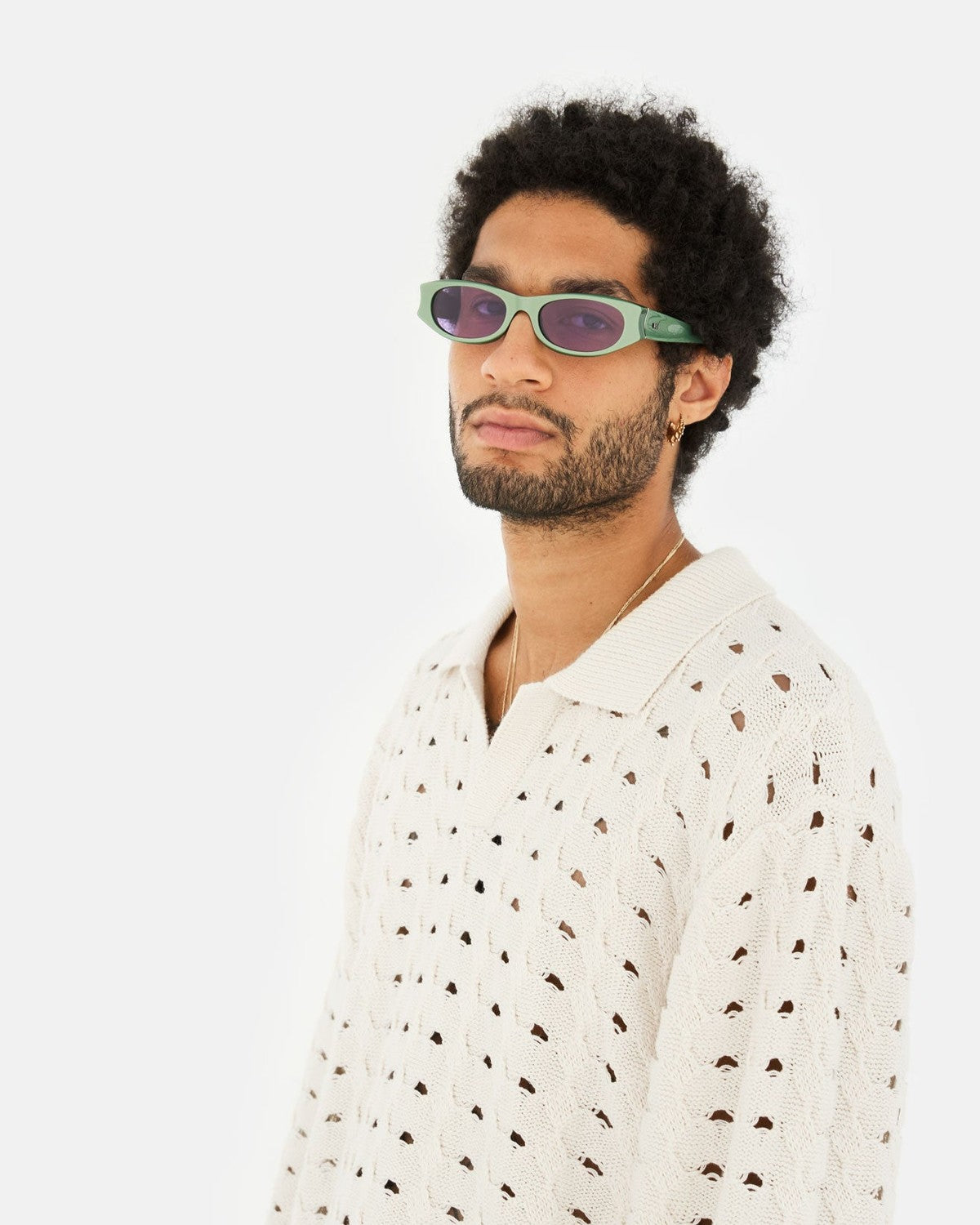 Side profile of model wearing RETROSUPERFUTURE Razzo Metallic Mint sunglasses.