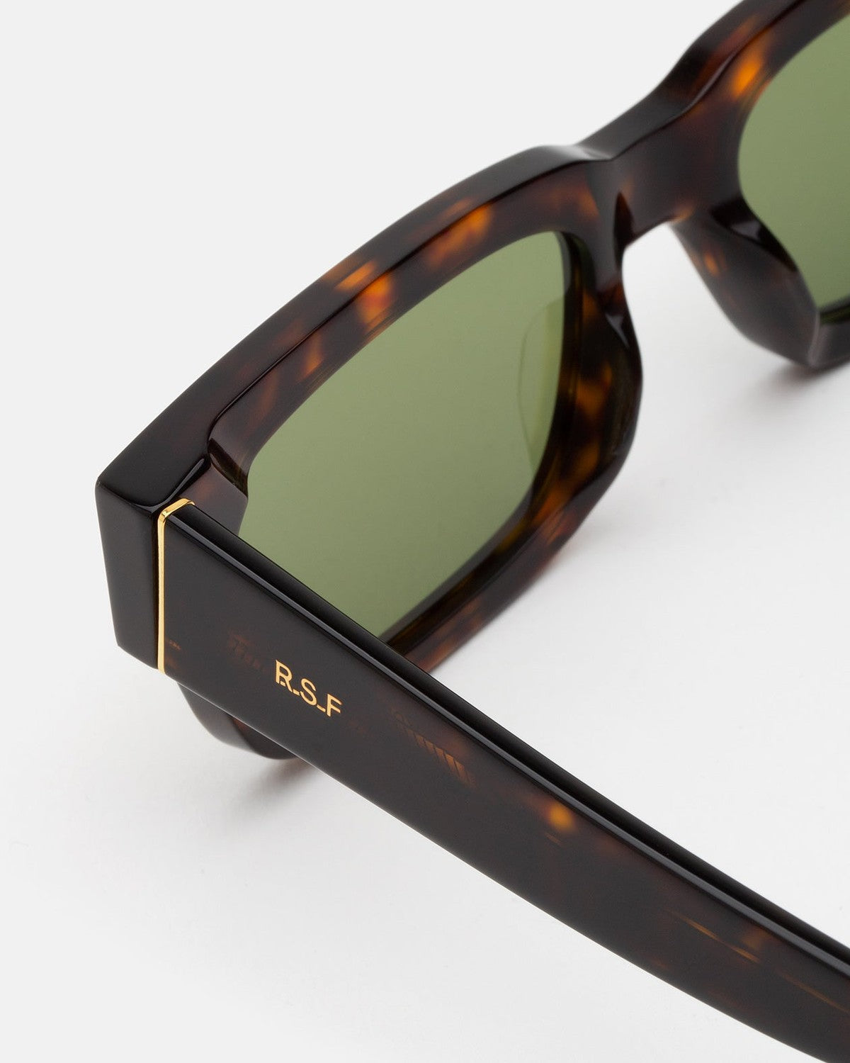 Close-up of the temple hinge and R.S.F branding on RETROSUPERFUTURE Roma 3627 Green sunglasses.