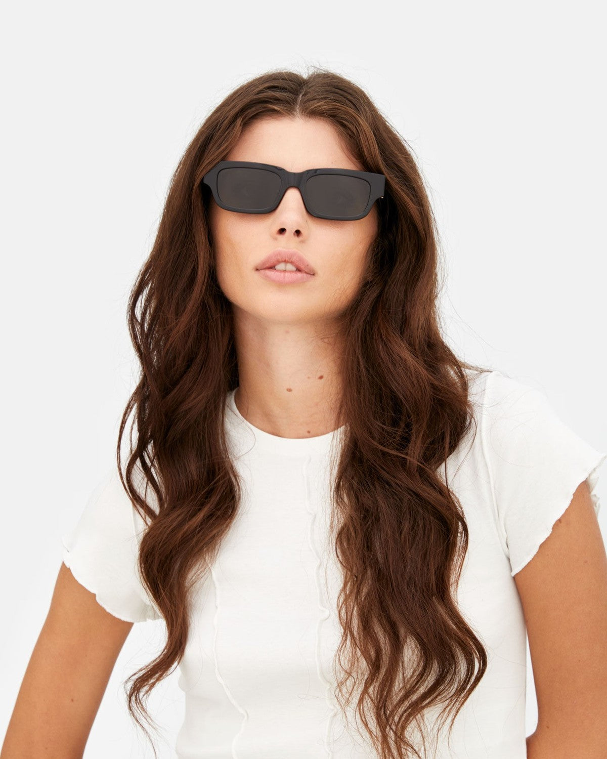 Model wearing RETROSUPERFUTURE Roma Black sunglasses.