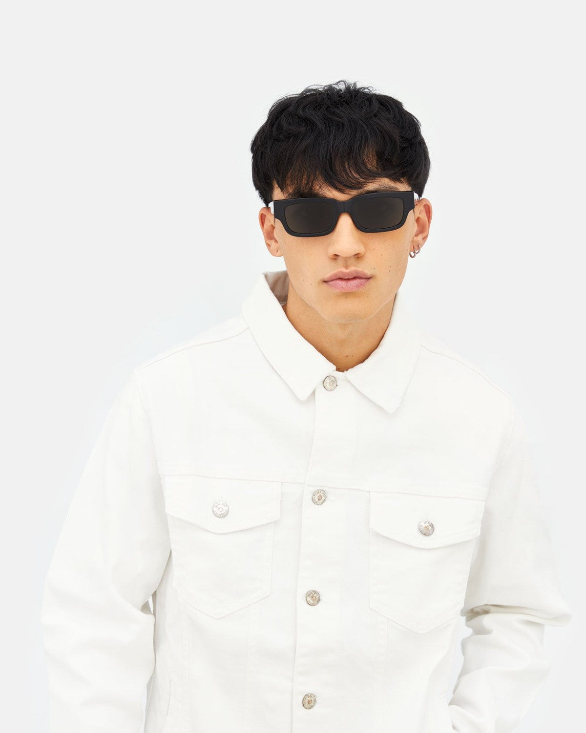 Model wearing RETROSUPERFUTURE Roma Black sunglasses with white shirt.