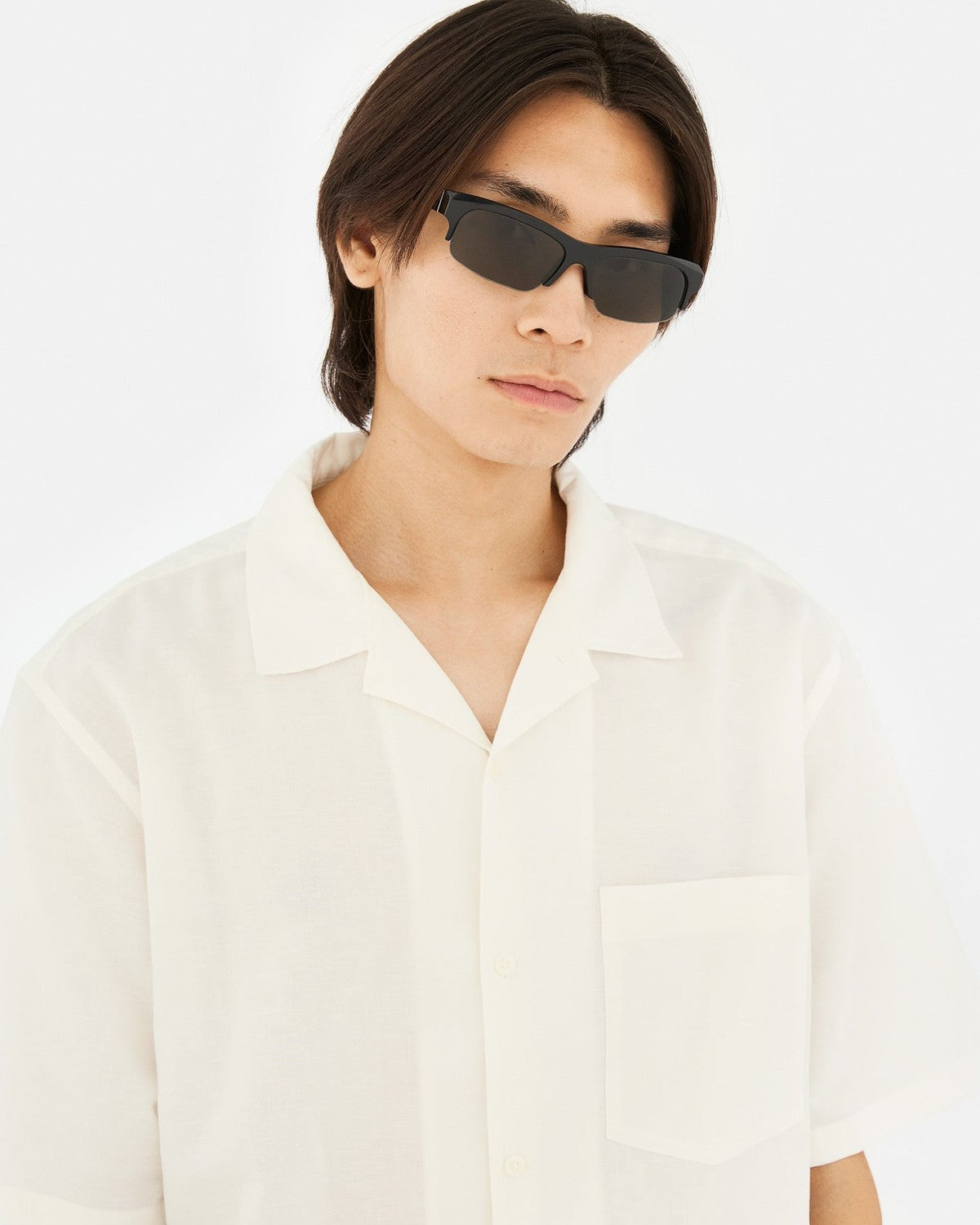 Model wearing RETROSUPERFUTURE Scatto Black sunglasses.