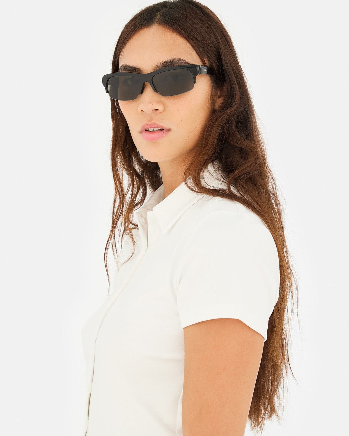Side view of model wearing RETROSUPERFUTURE Scatto Black sunglasses.