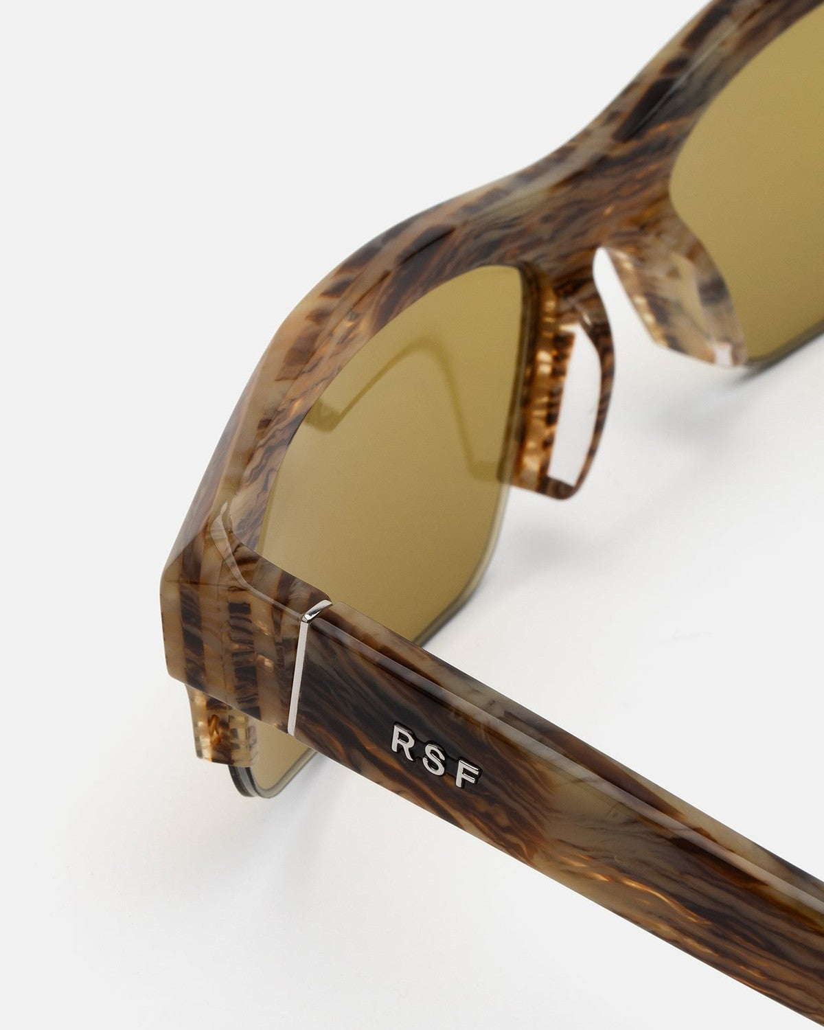 Close-up of the temple with RSF branding on RETROSUPERFUTURE Scatto Graffiato sunglasses.
