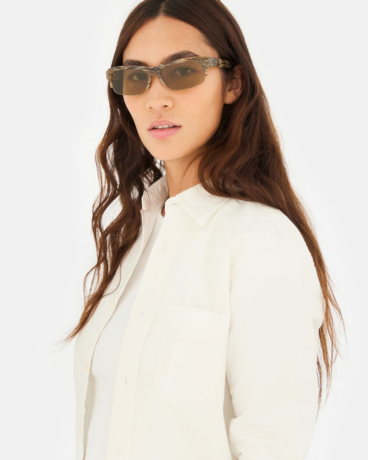 Model wearing RETROSUPERFUTURE Scatto Graffiato sunglasses with a white shirt.