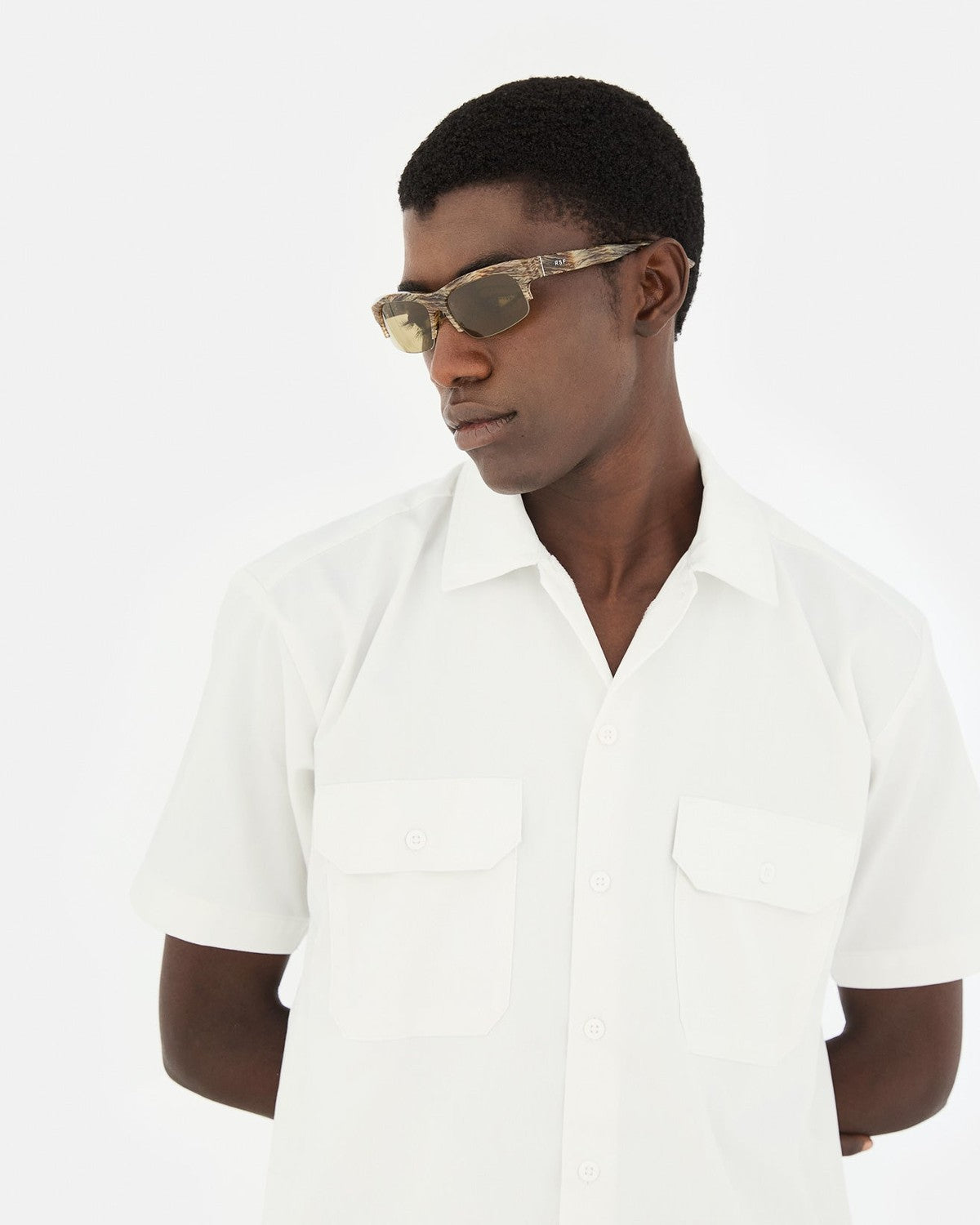 Side profile of model wearing RETROSUPERFUTURE Scatto Graffiato sunglasses.
