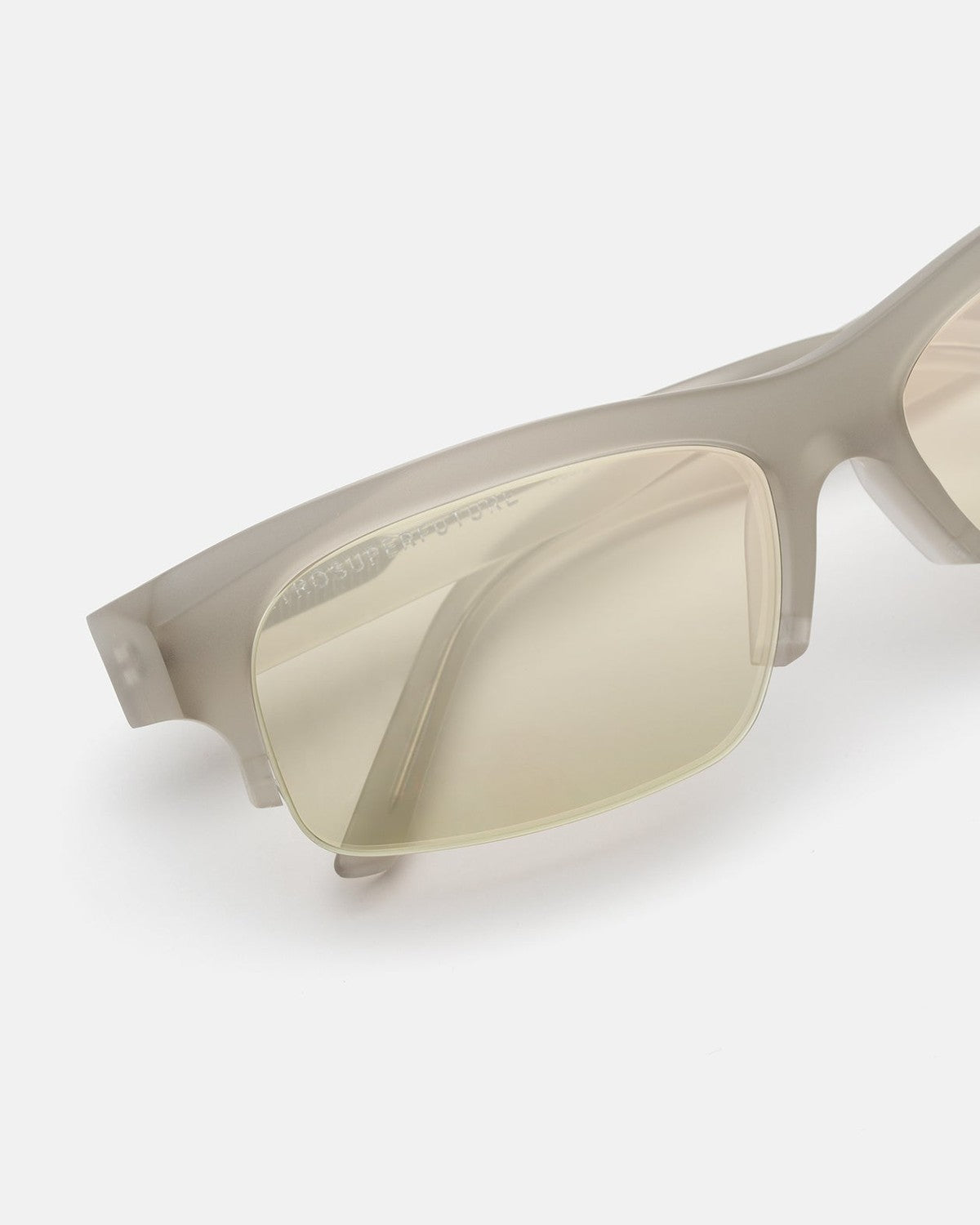 Close-up of the translucent frame and lens detail on RETROSUPERFUTURE Scatto Nebbia sunglasses.