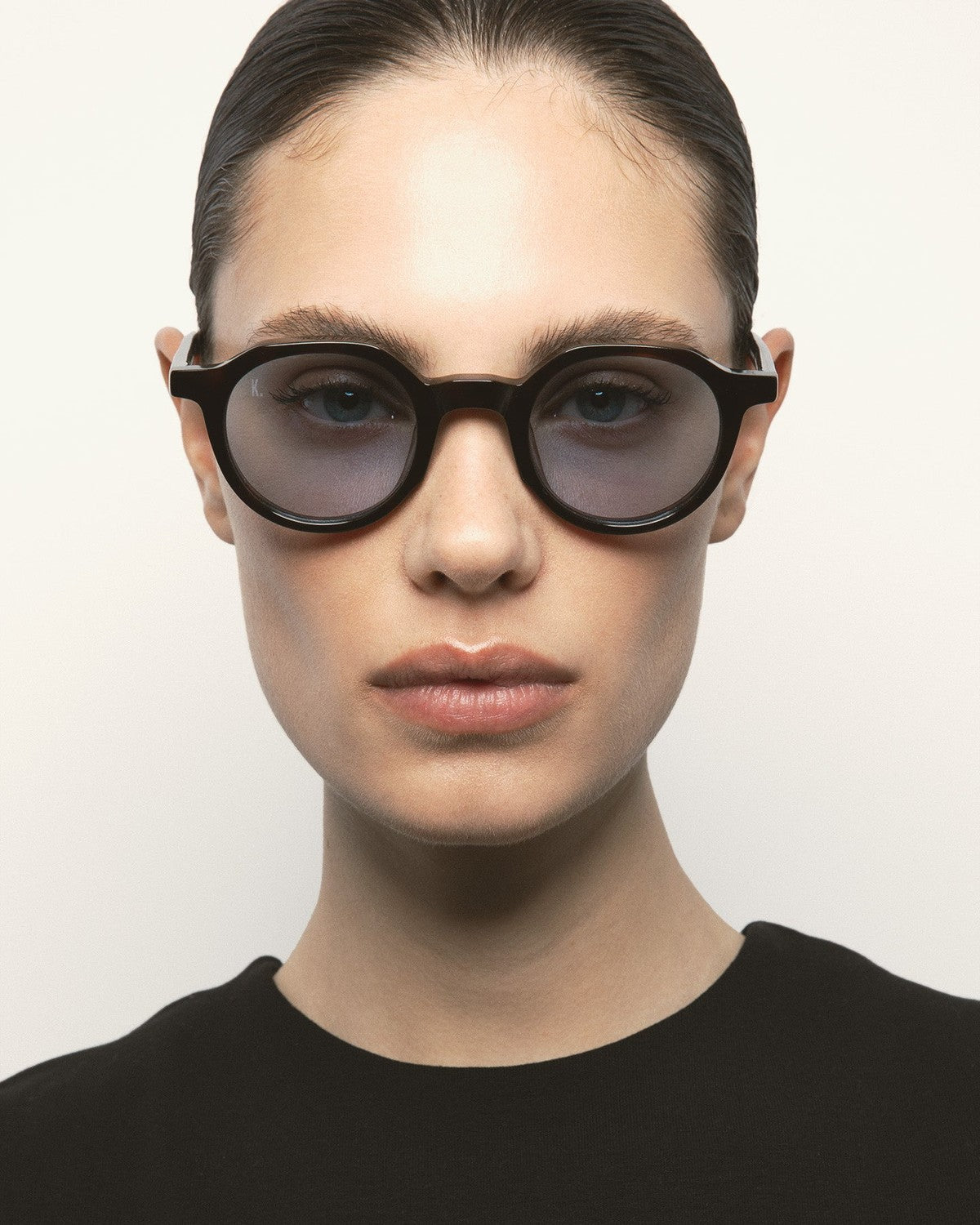 Model wearing KALEOS Scott Dark Havana Blue sunglasses, front view.