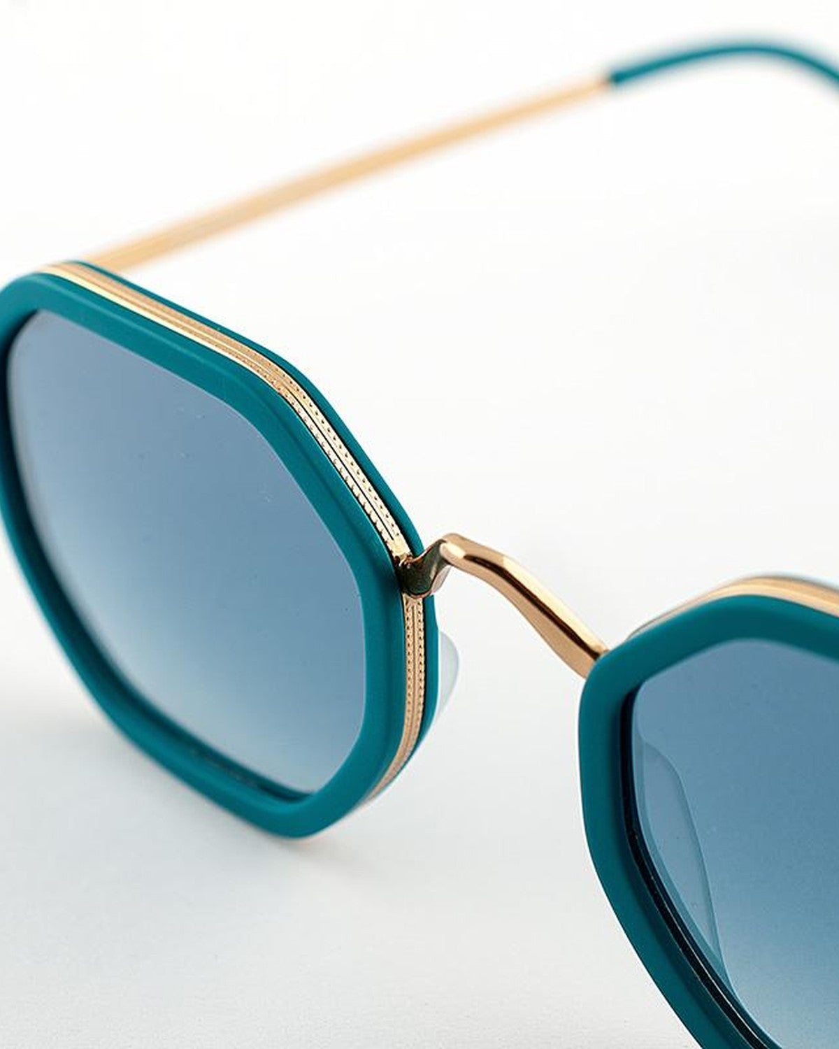 Close-up of the bridge and gold metal detailing on EYEPETIZER SENEQUIER C.T-4-26F sunglasses.