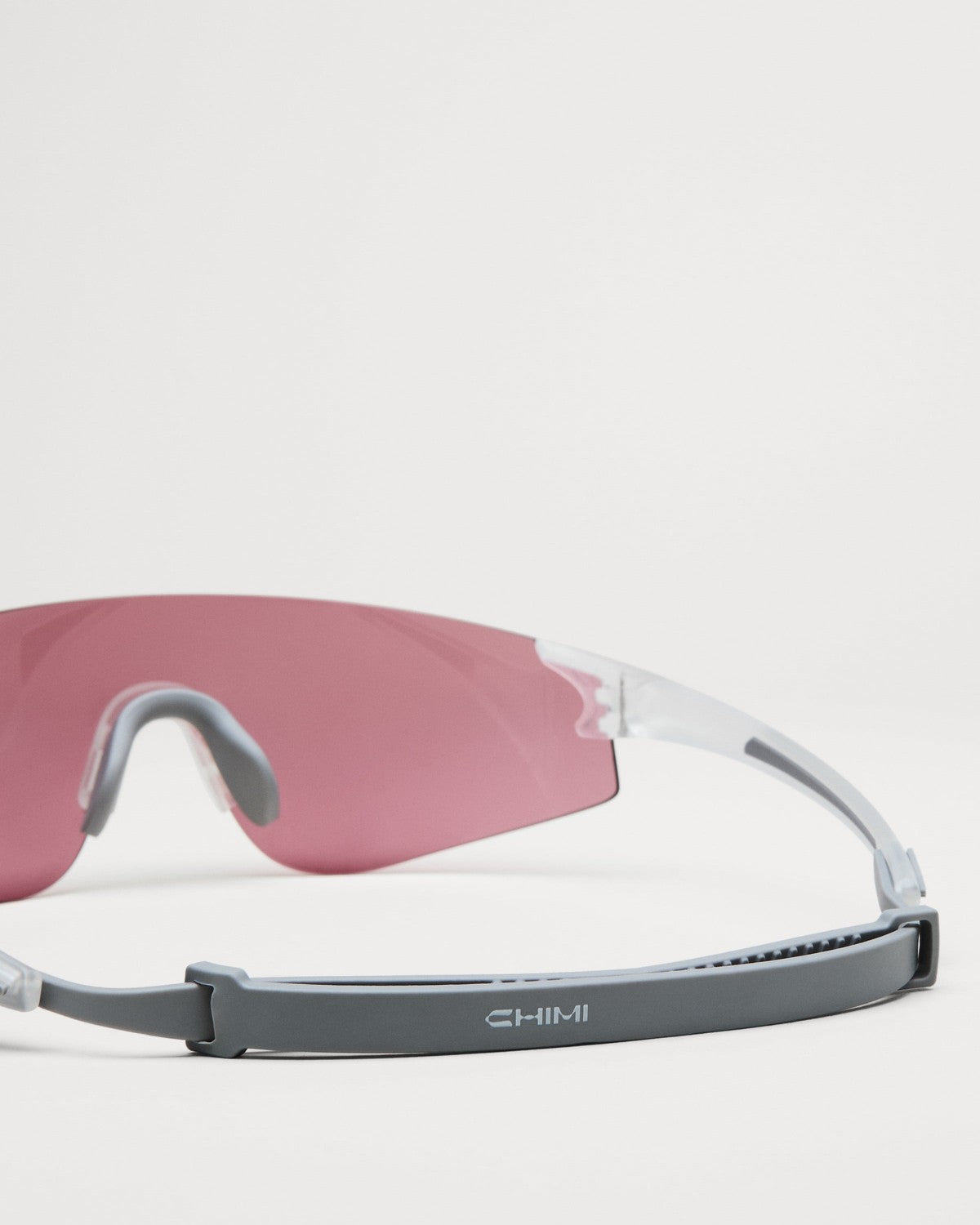Close-up of the adjustable retention strap on CHIMI Sierra Frosted Clear sunglasses.