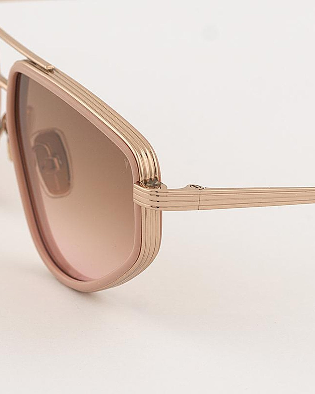 Close-up of the layered metal temple construction on EYEPETIZER SILENCIO C.Q-9-44 sunglasses.