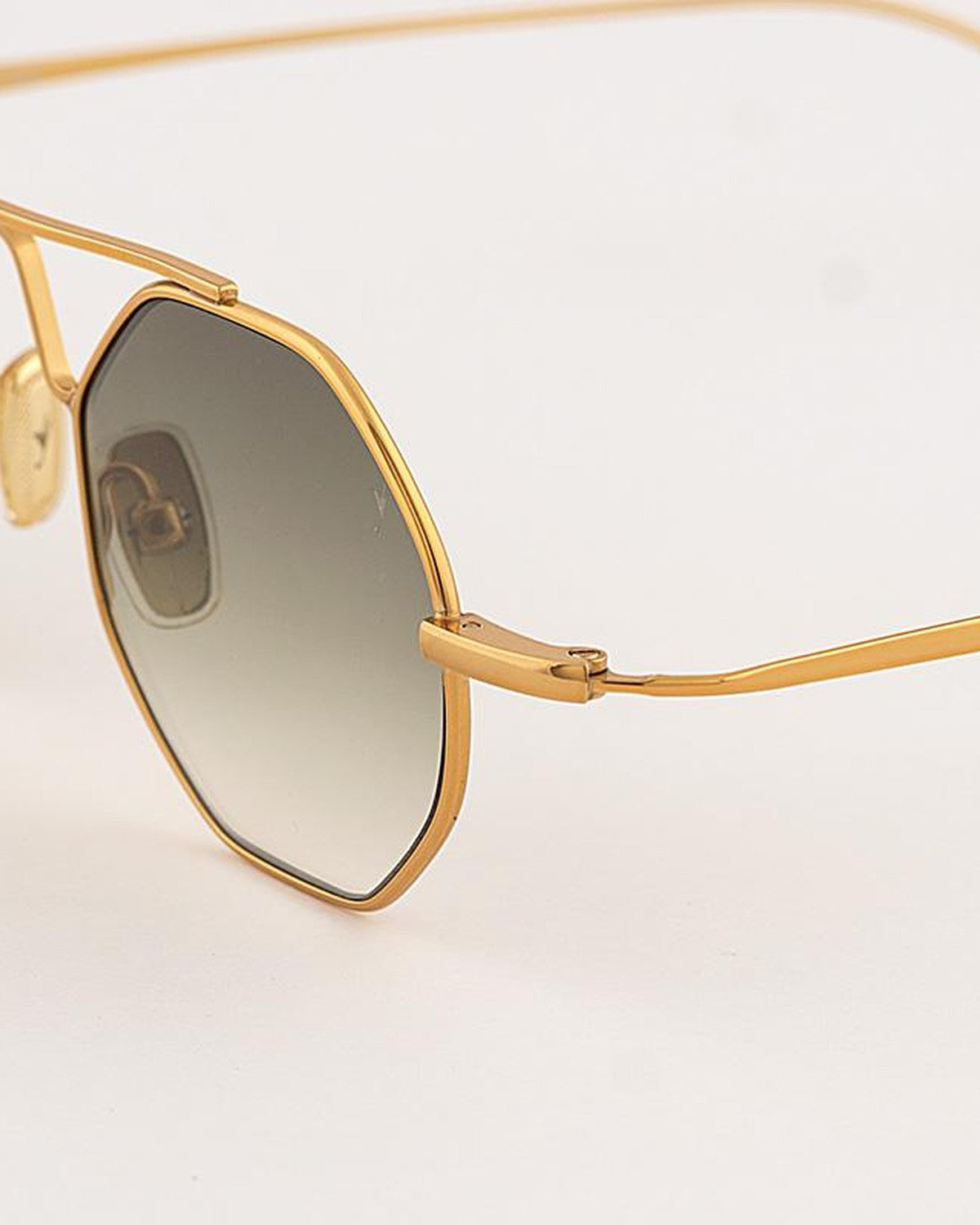 Close-up of the lens and temple junction on EYEPETIZER SOHO C.4-25 sunglasses showing metal construction.