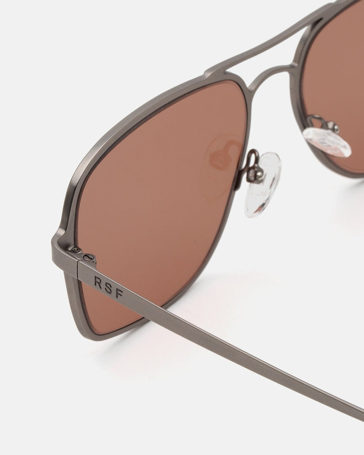 Close-up of the metal bridge and RSF temple branding on RETROSUPERFUTURE Spliff Boogie sunglasses.