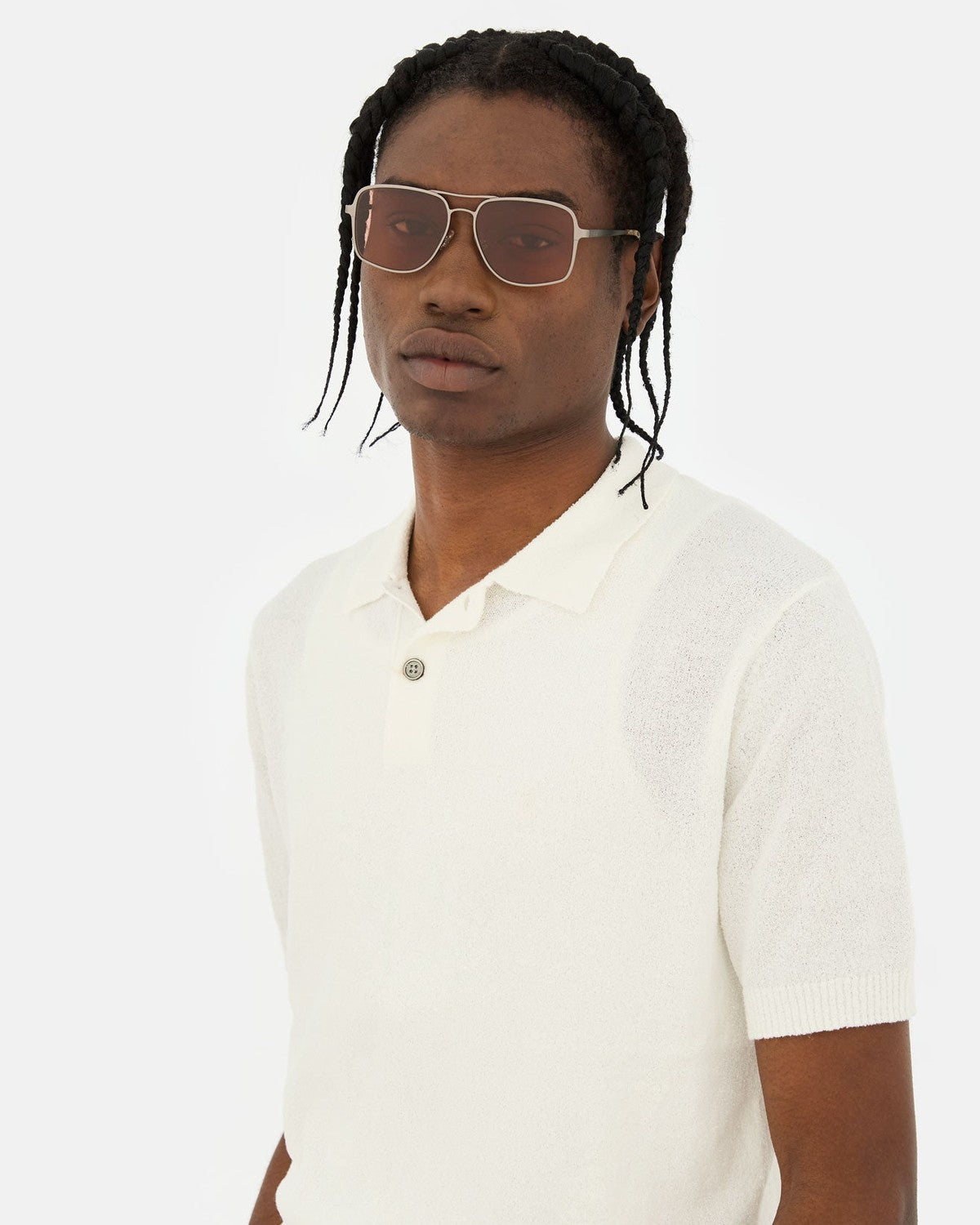 Model wearing RETROSUPERFUTURE Spliff Boogie sunglasses with a white polo shirt.