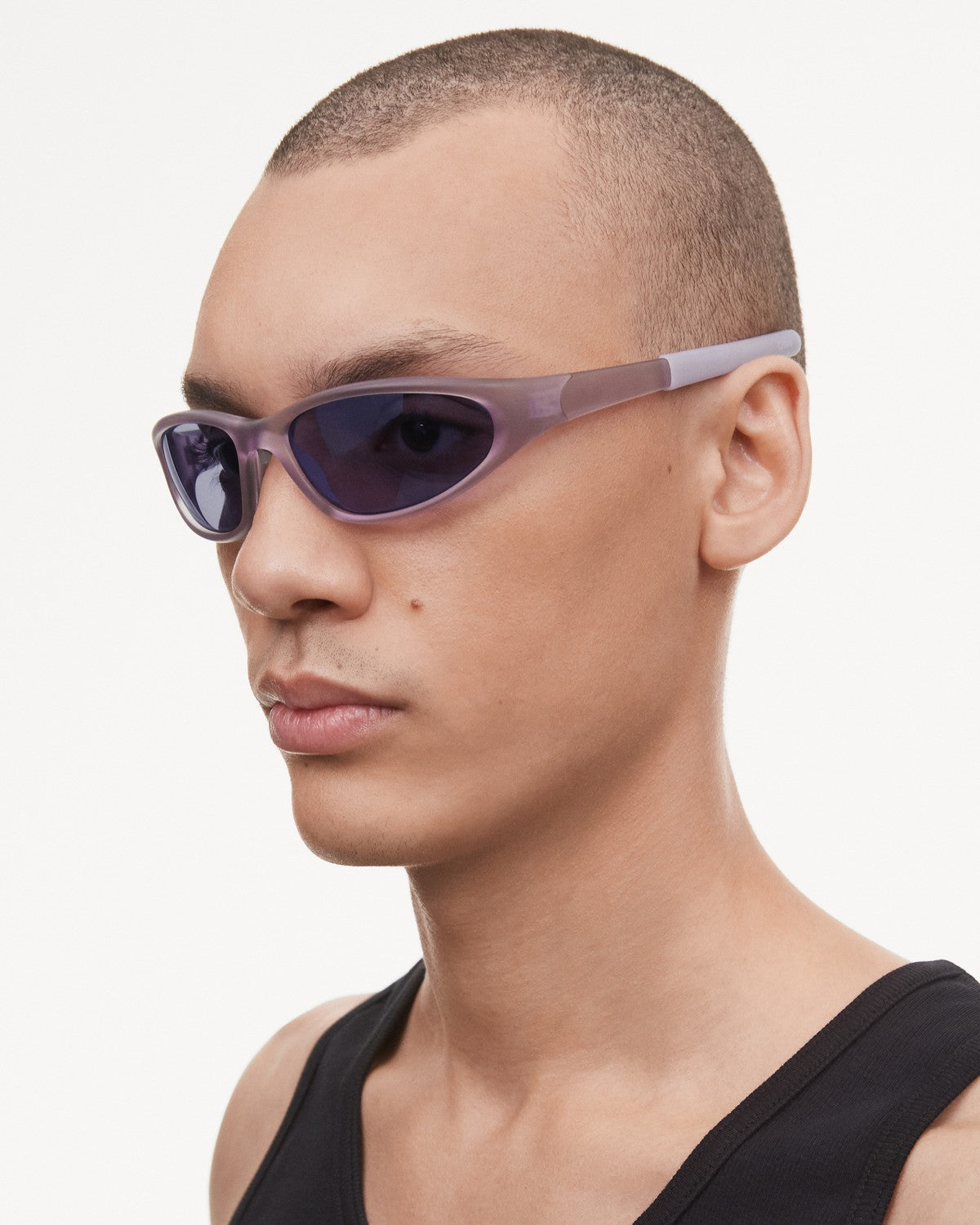 Angled view of model wearing CHIMI Split Lilac Purple Lens sunglasses.