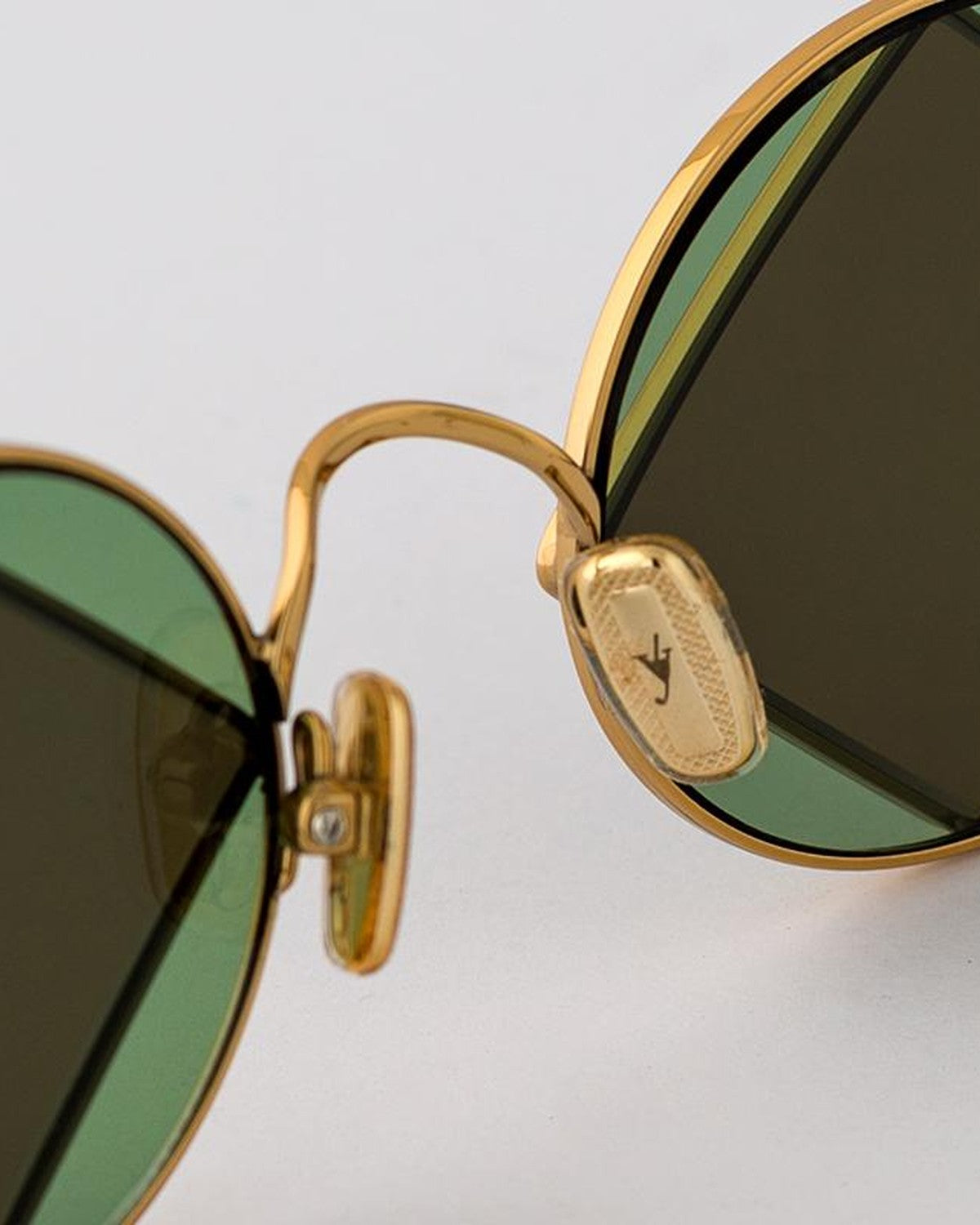 Close-up of the bridge and nose pad detail on EYEPETIZER SQUARE C.4-8 sunglasses.