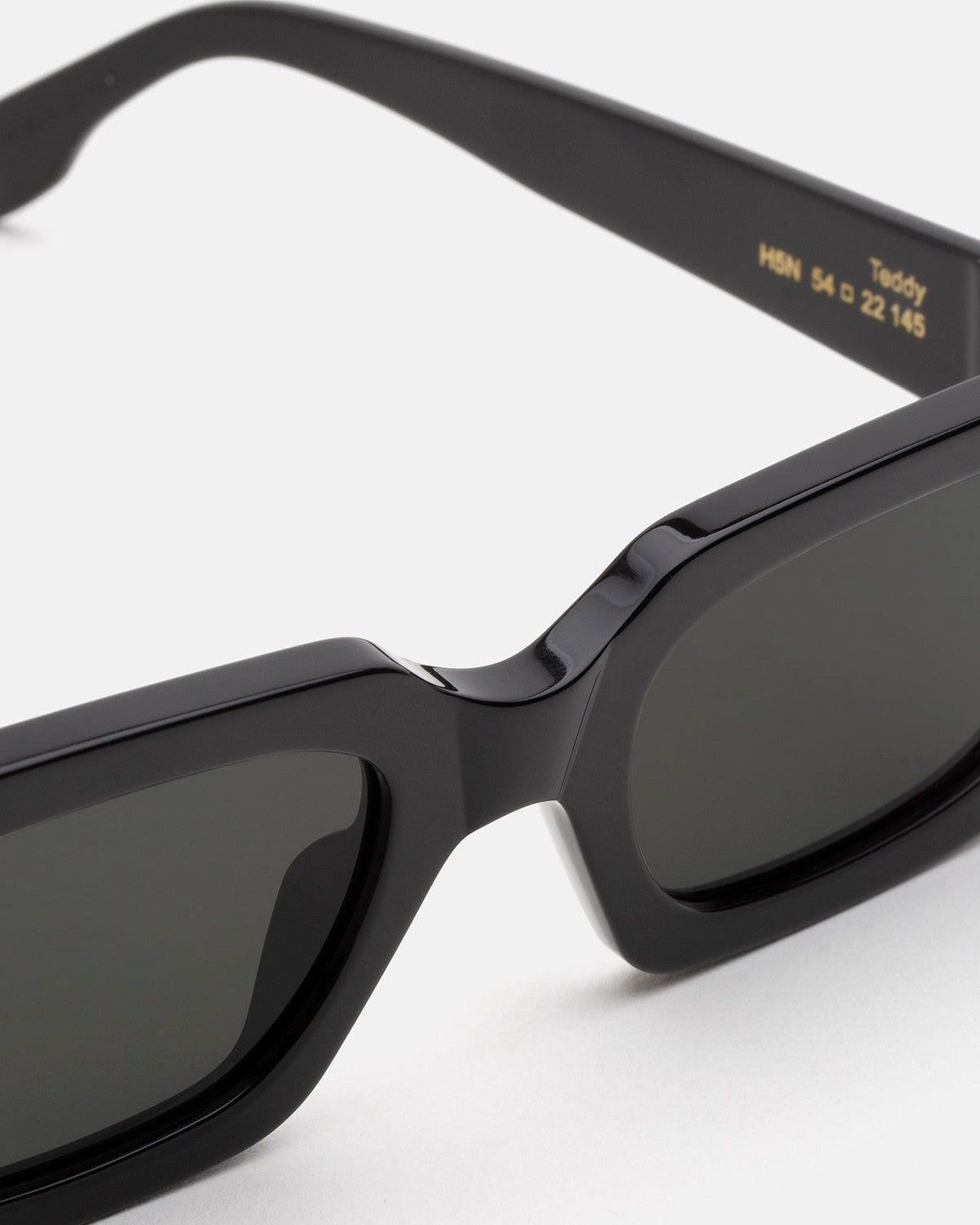 Close-up of the bridge and temple with size markings on RETROSUPERFUTURE Teddy Black sunglasses.