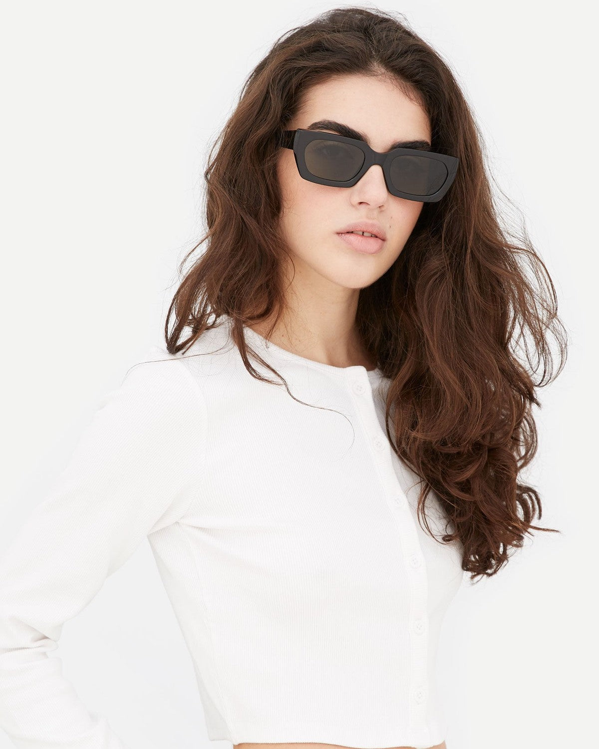 Model wearing RETROSUPERFUTURE Teddy Black sunglasses.