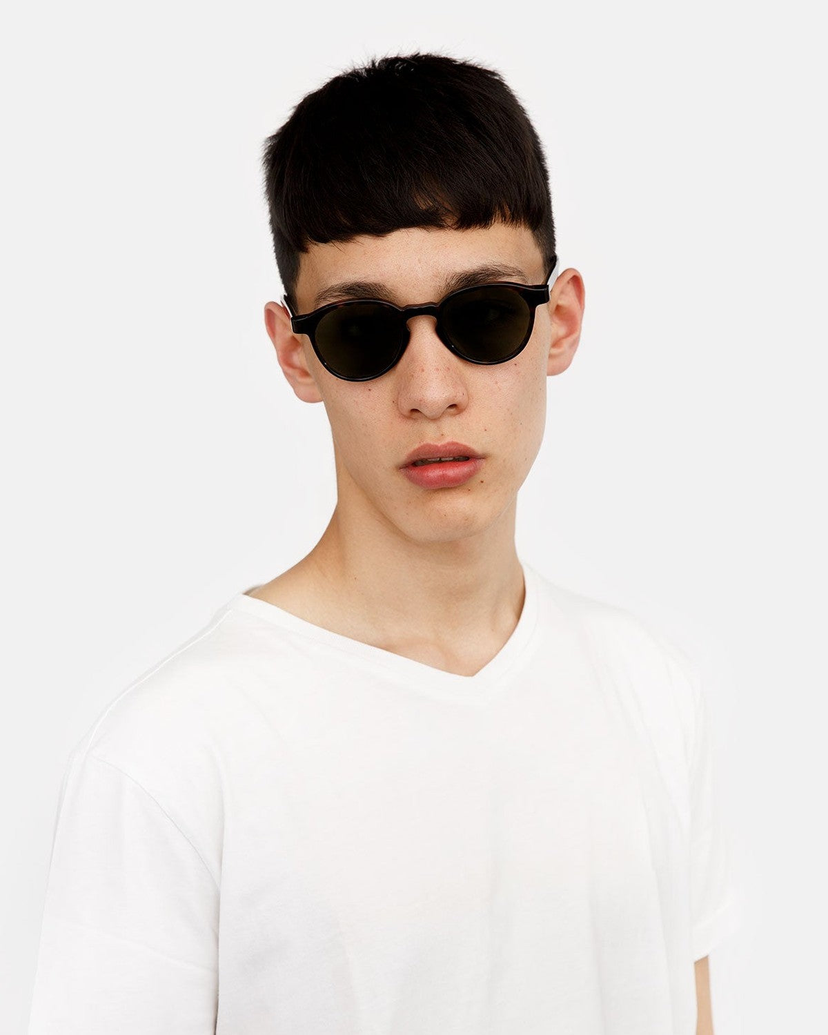 Model wearing RETROSUPERFUTURE The Warhol 3627 Green sunglasses.