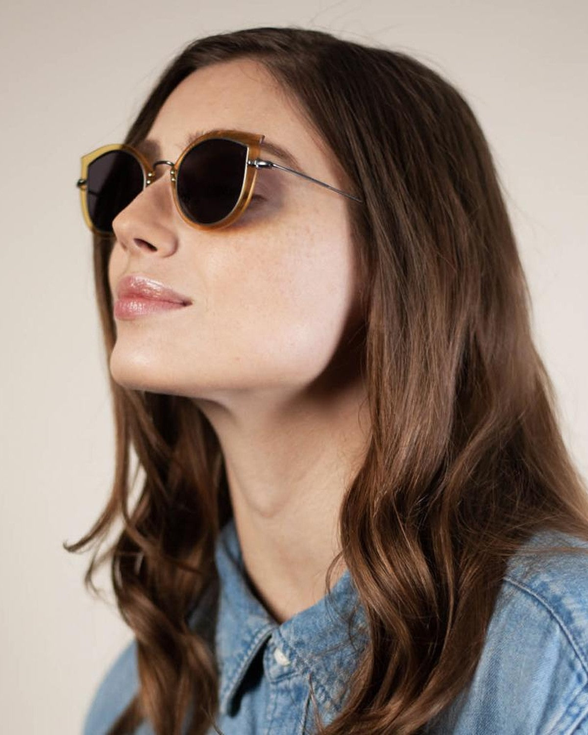 Model wearing EYEPETIZER THEA C.J-3-7 sunglasses in profile.