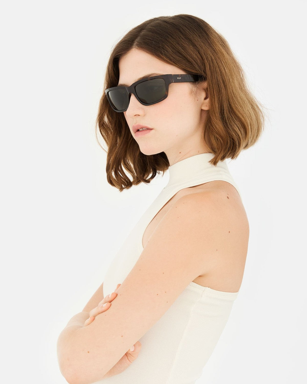 Model wearing RETROSUPERFUTURE Thelonius 3627 sunglasses, side view.