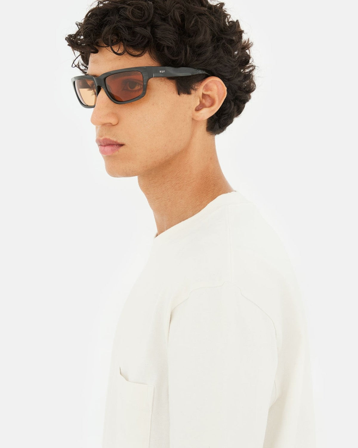 Side profile of RETROSUPERFUTURE Thelonius Fiammato sunglasses on model.
