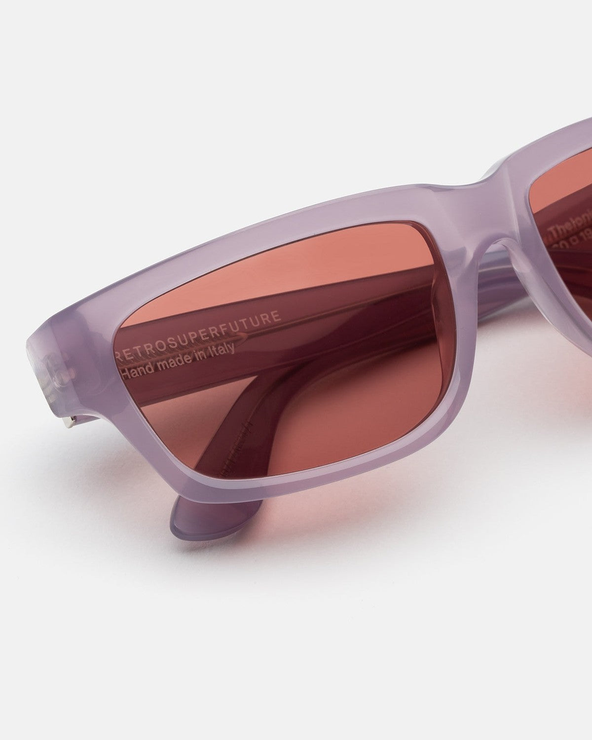 Close-up of the lens branding on RETROSUPERFUTURE Thelonius Light Purple sunglasses.