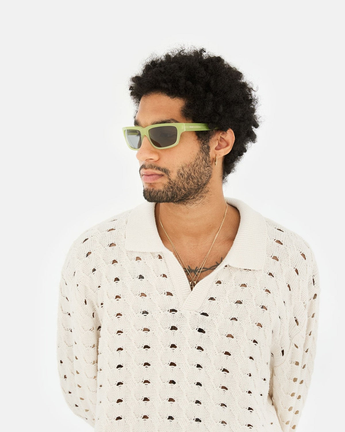 Model wearing RETROSUPERFUTURE Thelonius Lime sunglasses in profile.