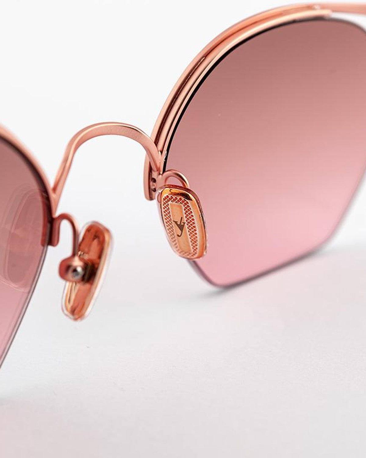 Detail of the engraved nose bridge and decorative temple attachment on EYEPETIZER TIBERIO C.9-OP-44F sunglasses.