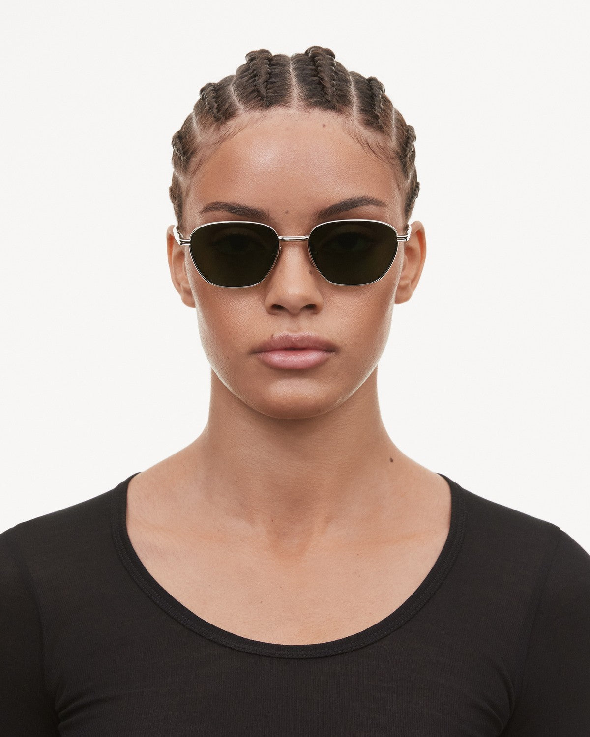 Model wearing CHIMI Polygon Green Green sunglasses, front view.