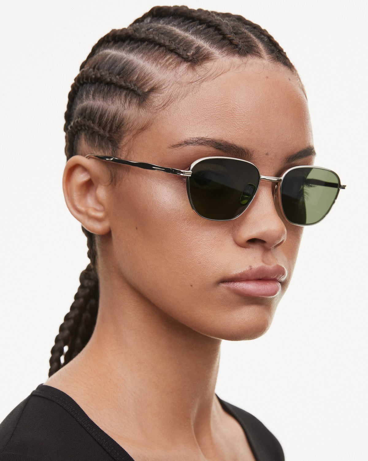 Model wearing CHIMI Polygon Green Green sunglasses, side profile.