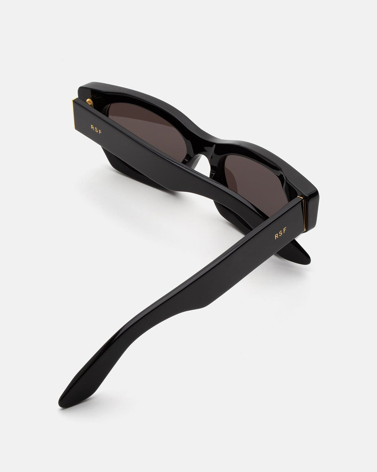 Interior view of RETROSUPERFUTURE Tono Black sunglasses with temples folded upward.