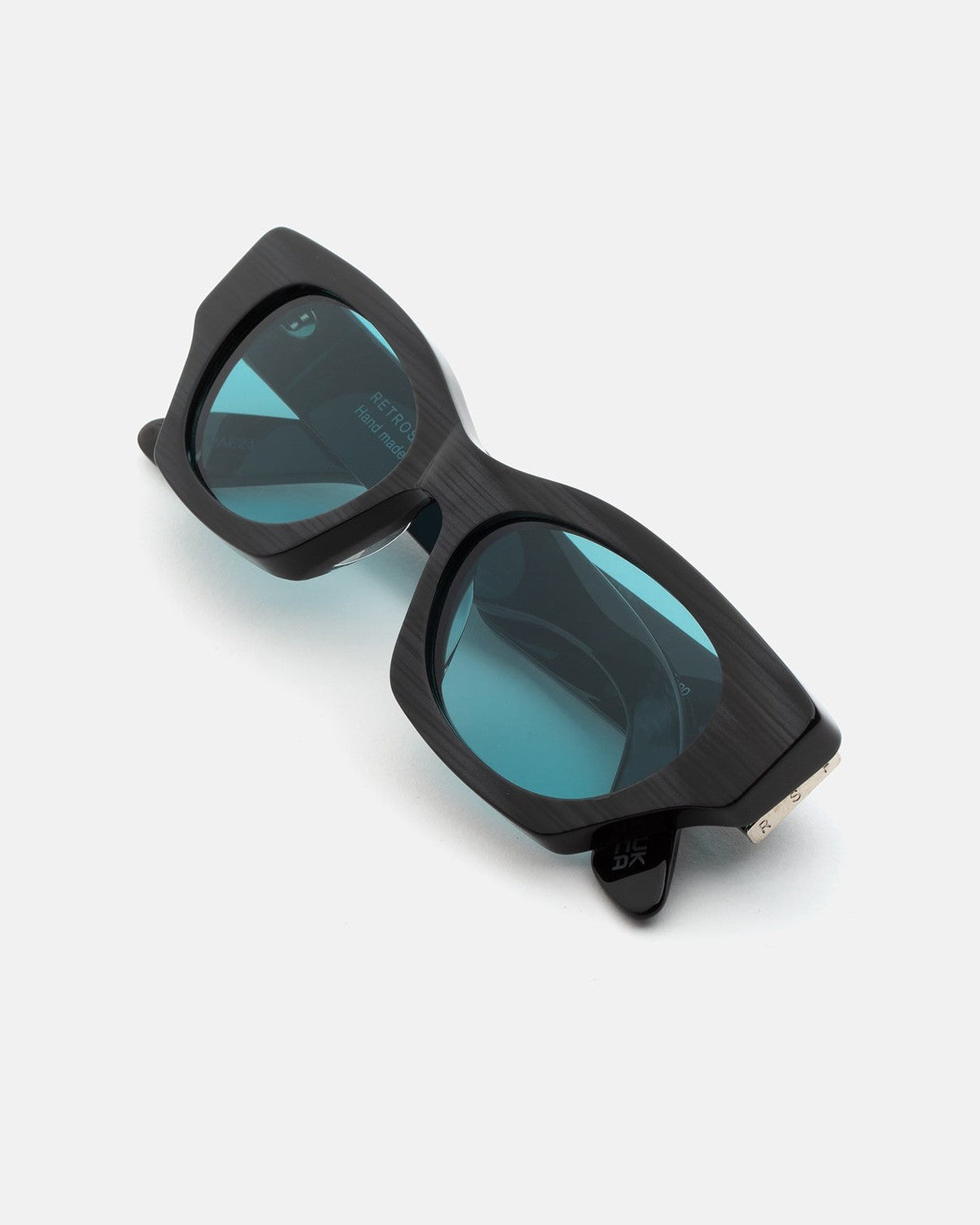 Folded view of RETROSUPERFUTURE Tono Fiammato sunglasses showing the lens details.