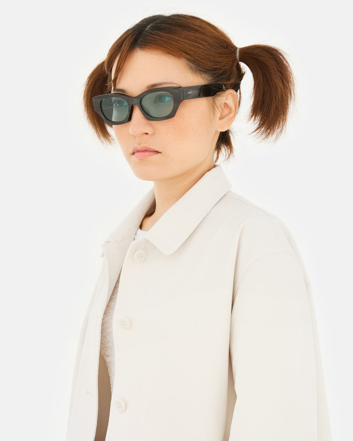 Model wearing RETROSUPERFUTURE Tono Fiammato sunglasses in a side profile.