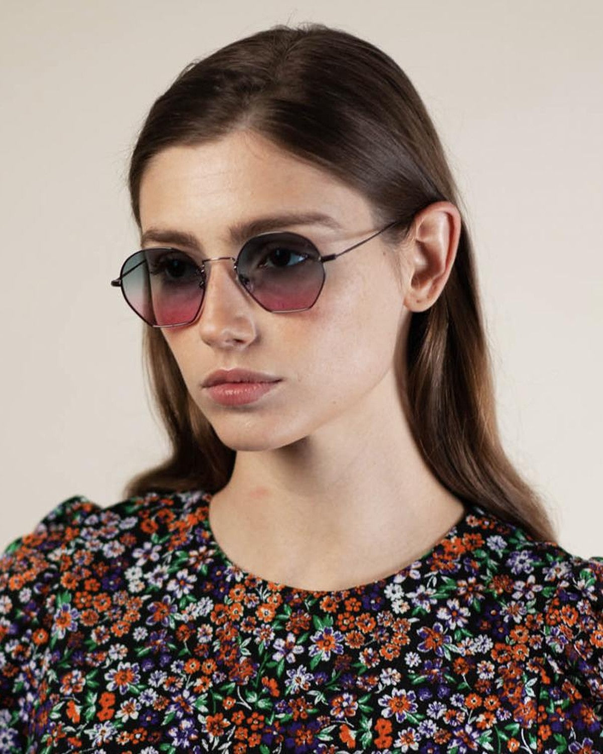 Model wearing EYEPETIZER TRIOMPHE C.3-20 sunglasses with floral patterned top.
