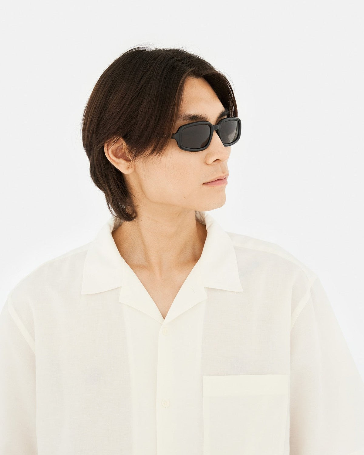 Model wearing RETROSUPERFUTURE Troll Black sunglasses.
