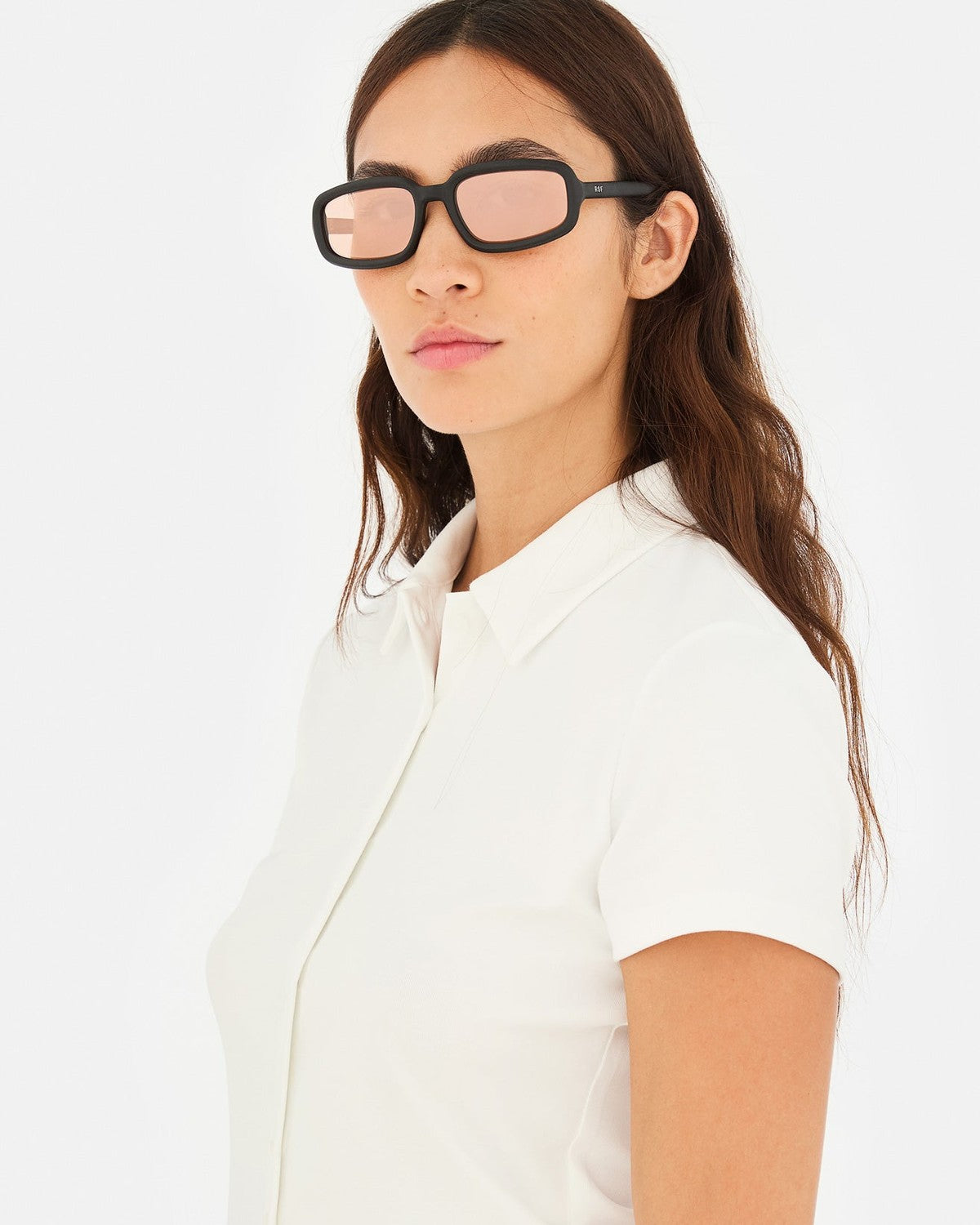 Model wearing RETROSUPERFUTURE Troll Black Matte sunglasses with white shirt.