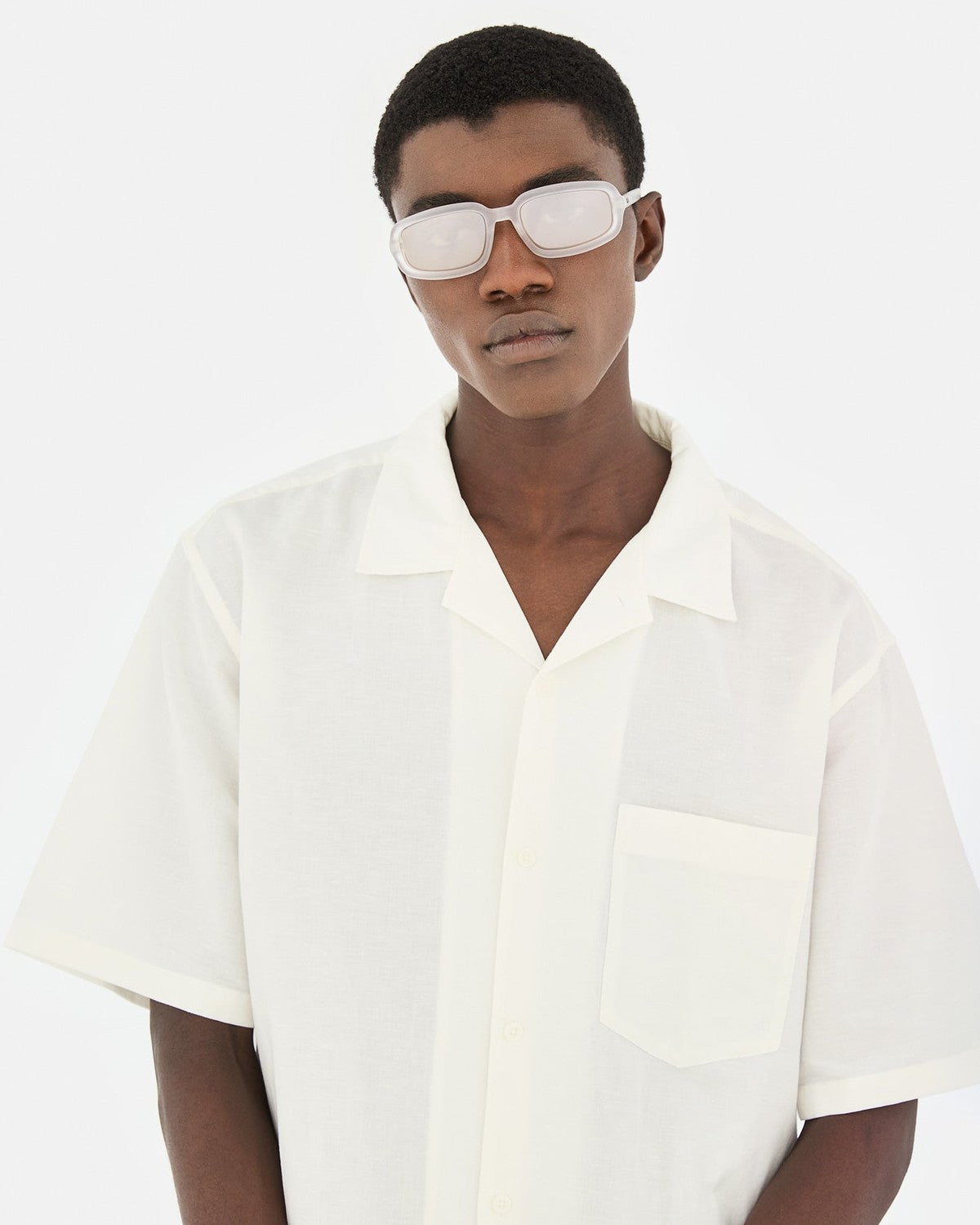 Front lifestyle view of RETROSUPERFUTURE Troll Frozen sunglasses worn by a model.